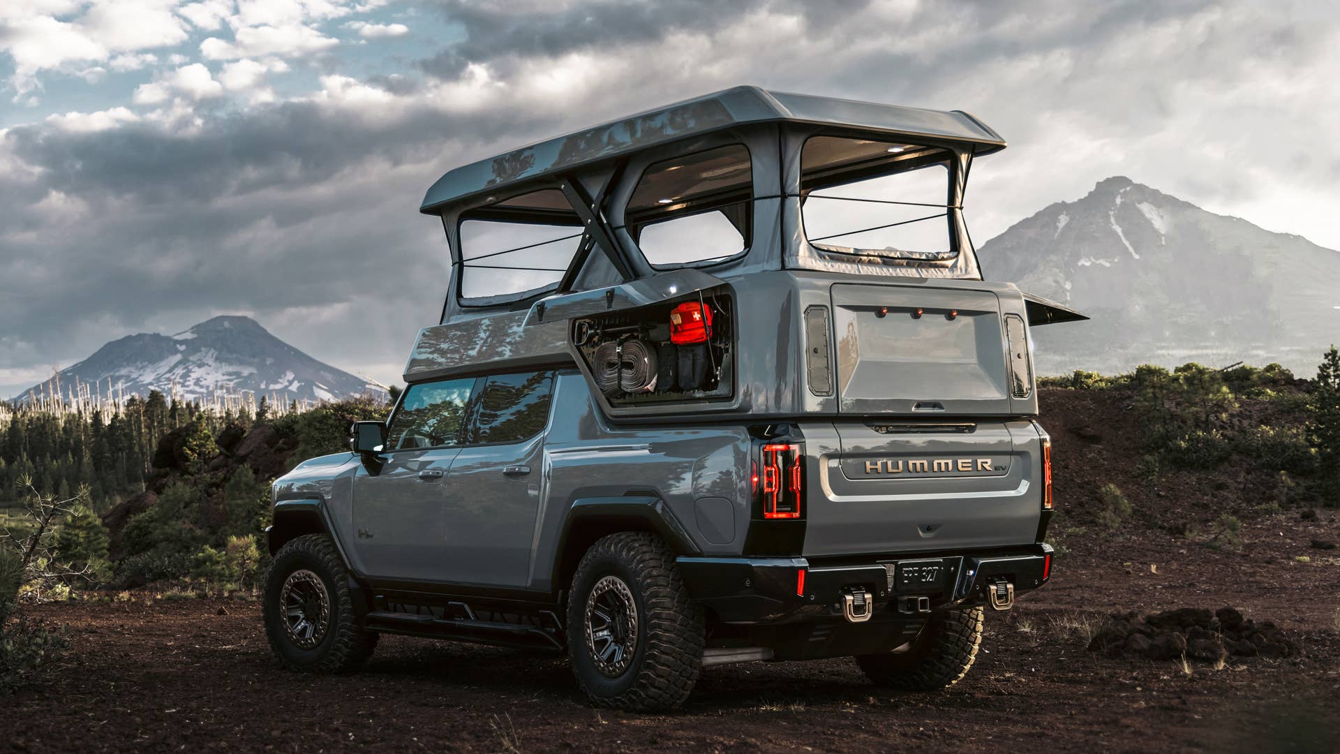 Rear 3/4 shot of the GMC HUMMER EV EarthCruiser Upfit by EarthCruiser.