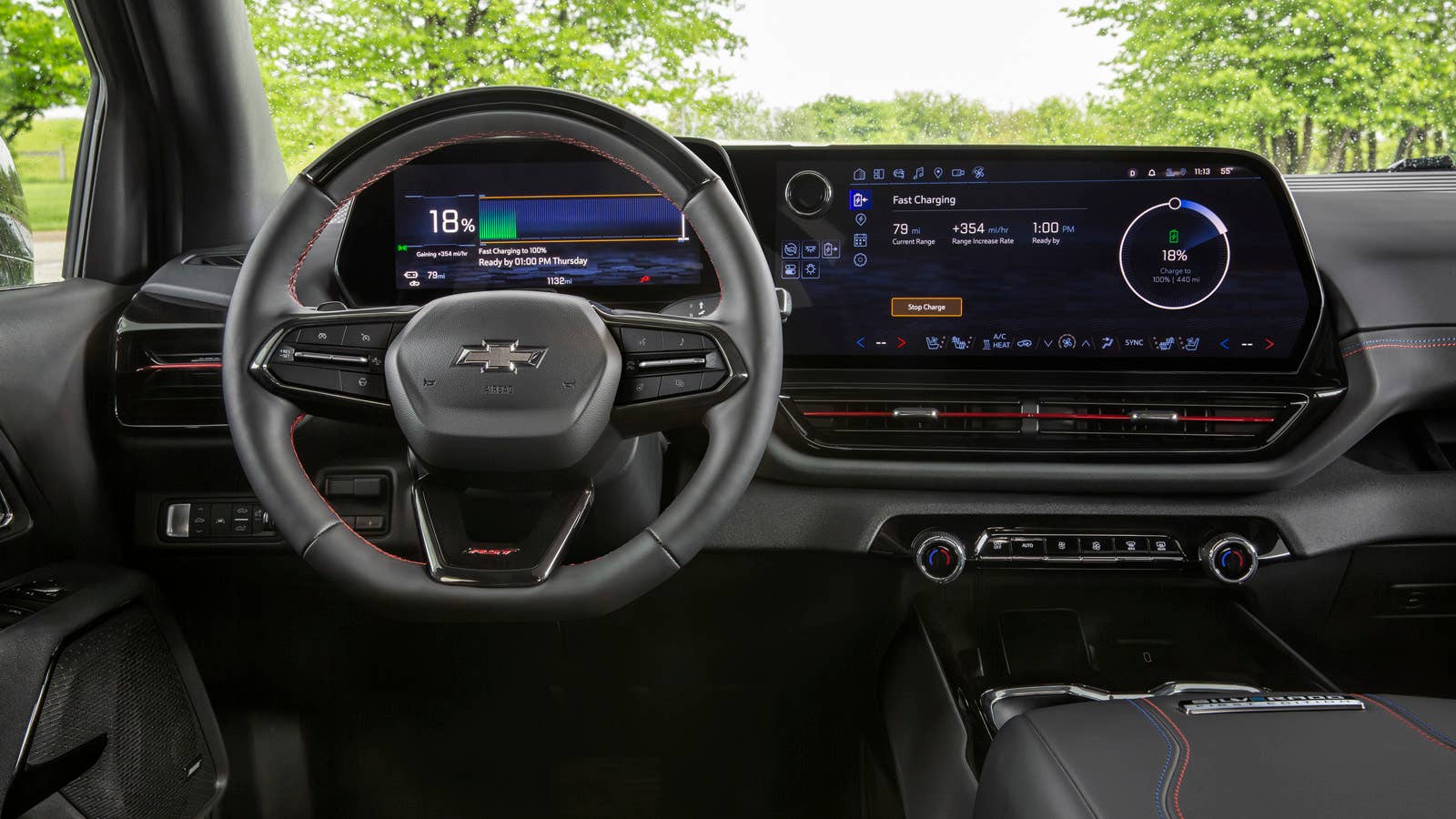 A driver’s view of the 2024 Silverado EV RST’s cockpit showing the driver information and infotainment screens.