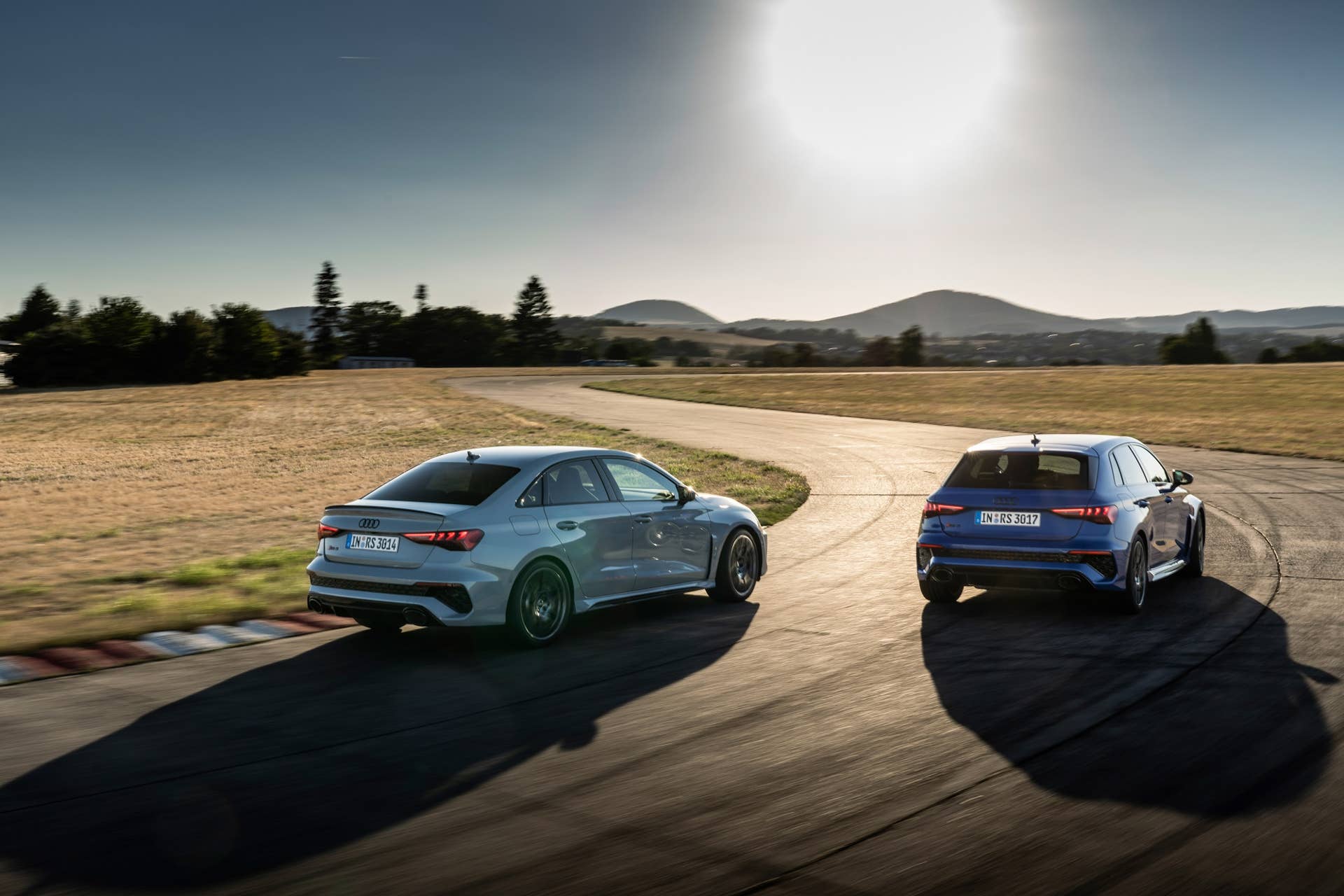 Audi RS 3 Sedan performance edition, Dynamic photo, Colour: Arrow Gray, Pearl Effect. Audi RS 3 Sportback performance edition, Dynamic photo, Colour: Nogaro Blue, Pearl Effect .