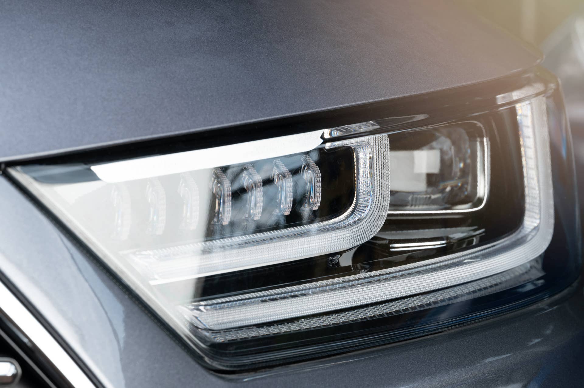 Shiny led car headlight lamp macro close up view. Elegant new lamps
