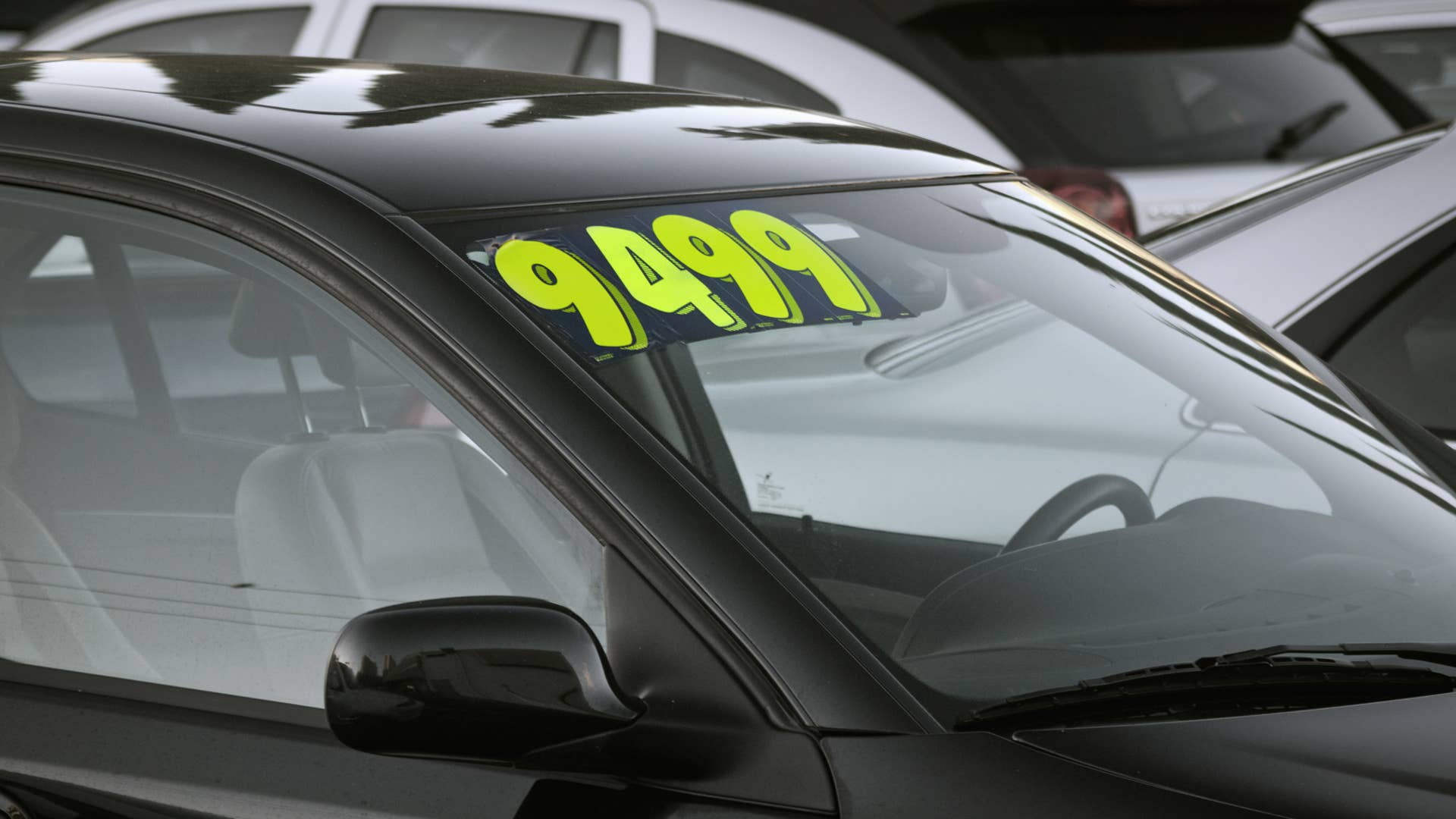 auto for sale in a used car lot.