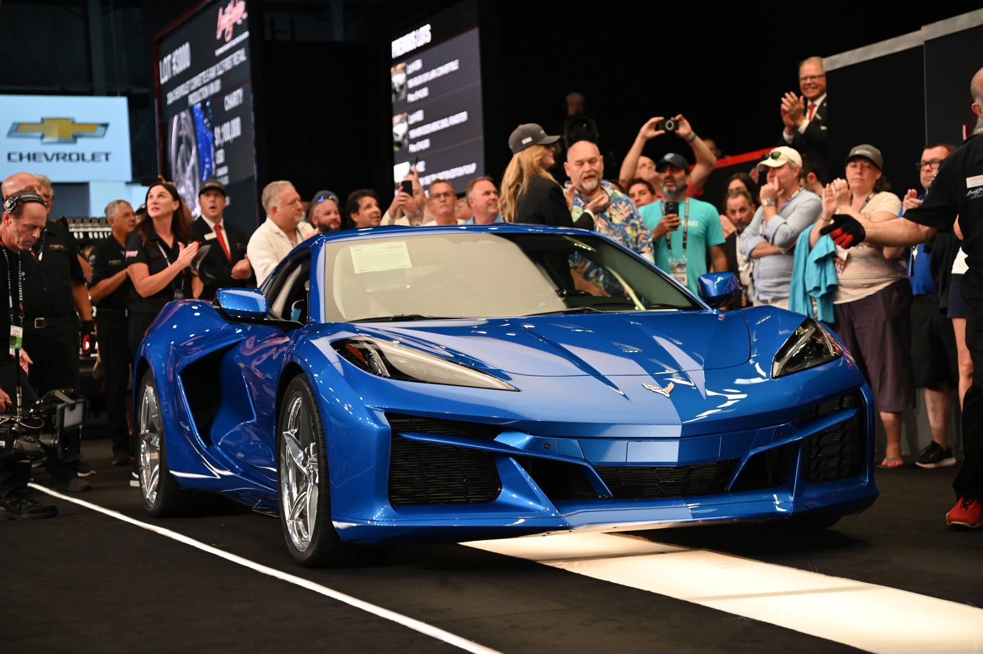 Front 3/4 view of 2024 Chevrolet Corvette E-Ray in Riptide Blue crossing the auction block at the 2023 Barrett-Jackson Palm Beach auction.