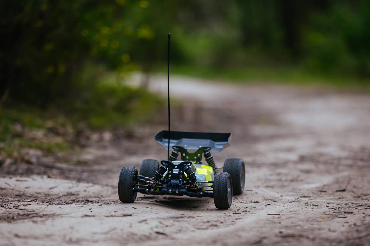 An offroad radio controlled car in action in rural bushland in Victoria, Australia