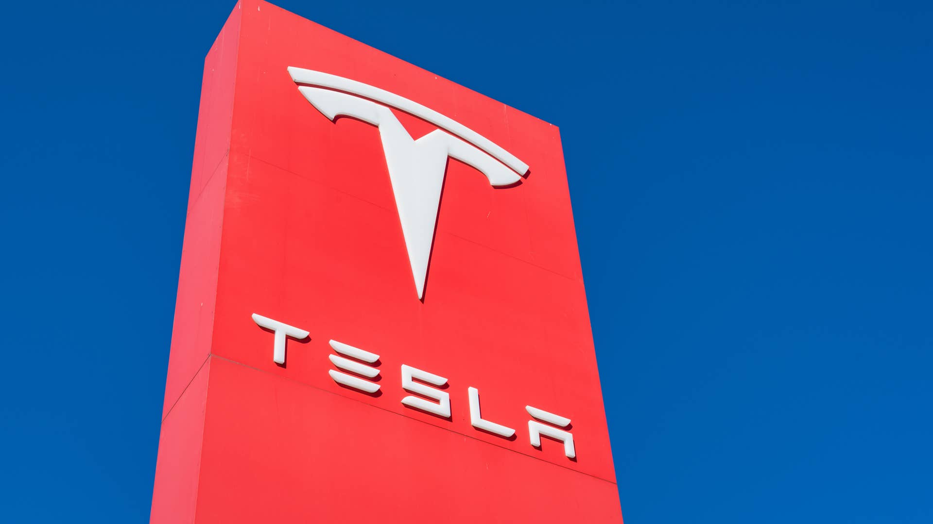 Austin , Texas , USA - November 11th , 2020: Tesla Motors now an SP500 company with a busy Pond Springs location in northwest Austin , TX