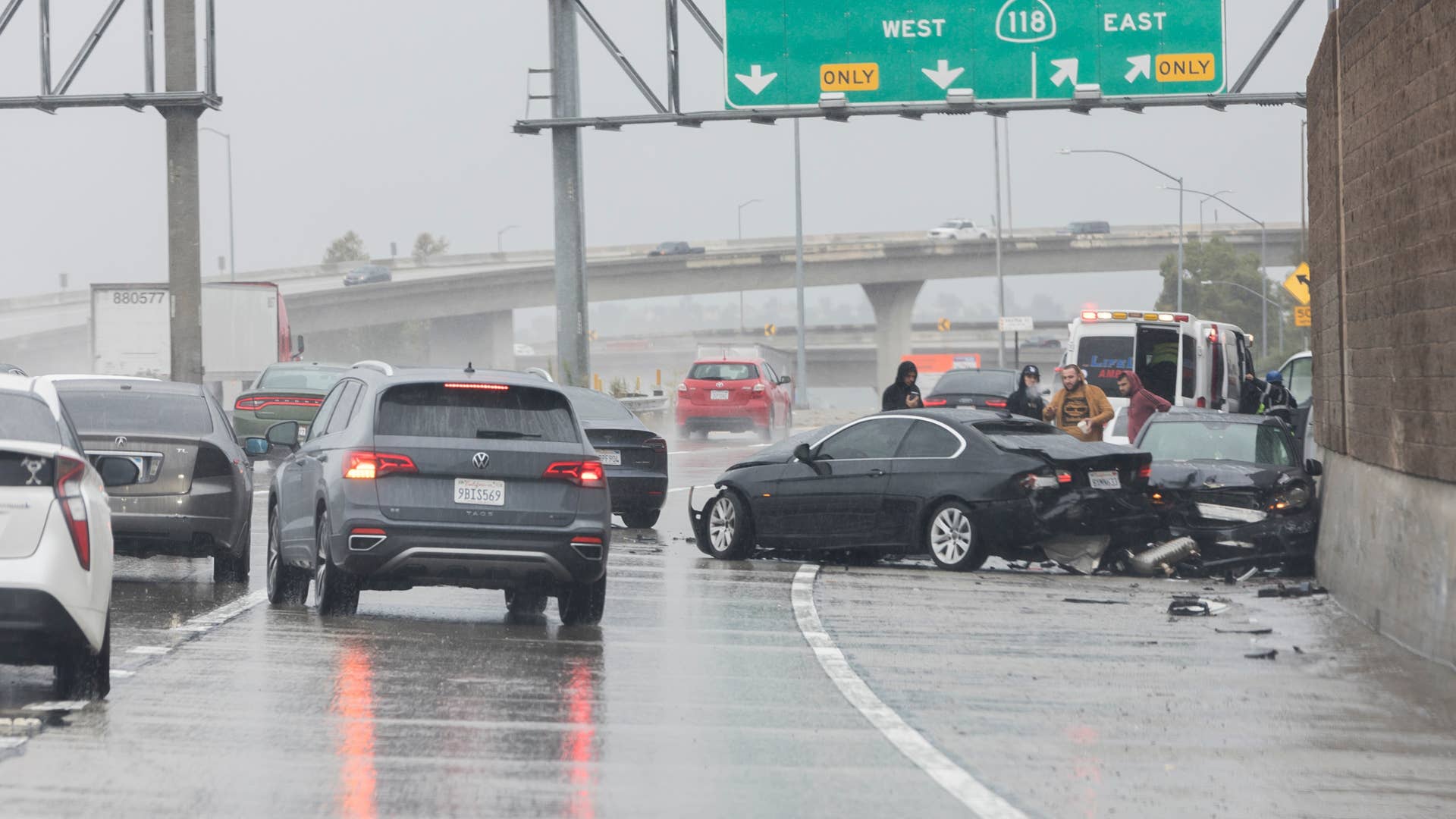 Los Angeles, California, USA - August 20,2023: Heavy rains and a three car accident on the 5 freeway just before the 118 freeway interchange during heavy rains of tropical storm Hurricane Hilary.