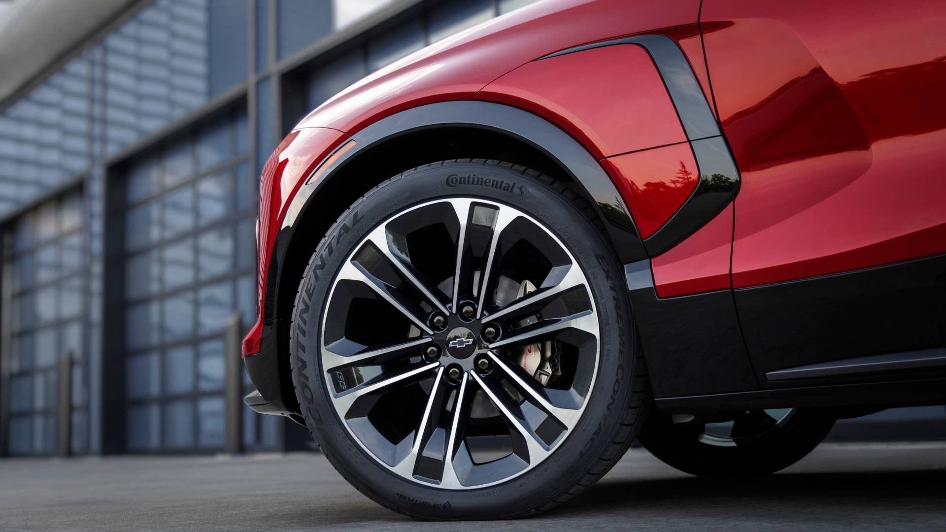Close up of the front driver’s side wheel on the 2024 Chevrolet Blazer EV SS in Radiant Red Tintcoat. Preproduction model shown. Actual production model may vary. 2024 Chevrolet Blazer EV available Spring 2023.