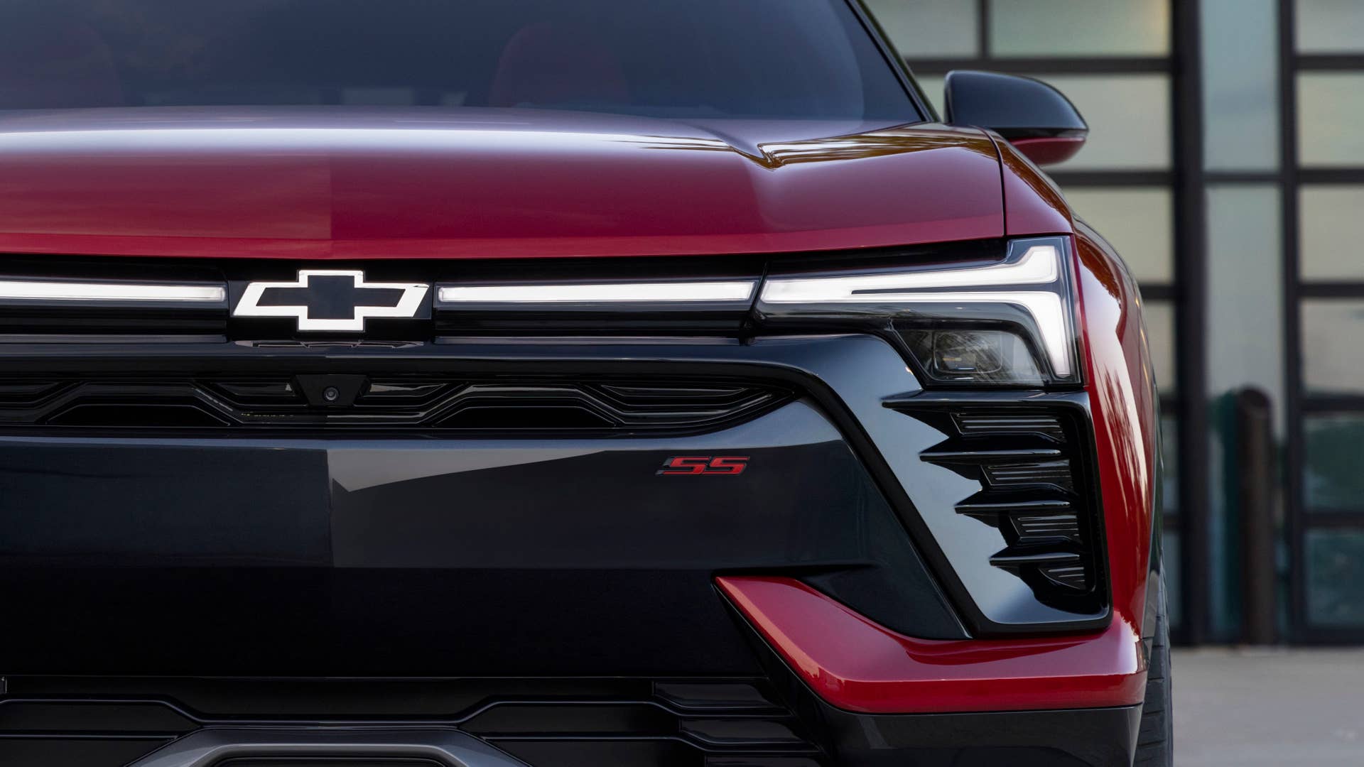 Close up, front view of the 2024 Chevrolet Blazer EV SS in Radiant Red Tintcoat. Preproduction model shown. Actual production model may vary. 2024 Chevrolet Blazer EV available Spring 2023.