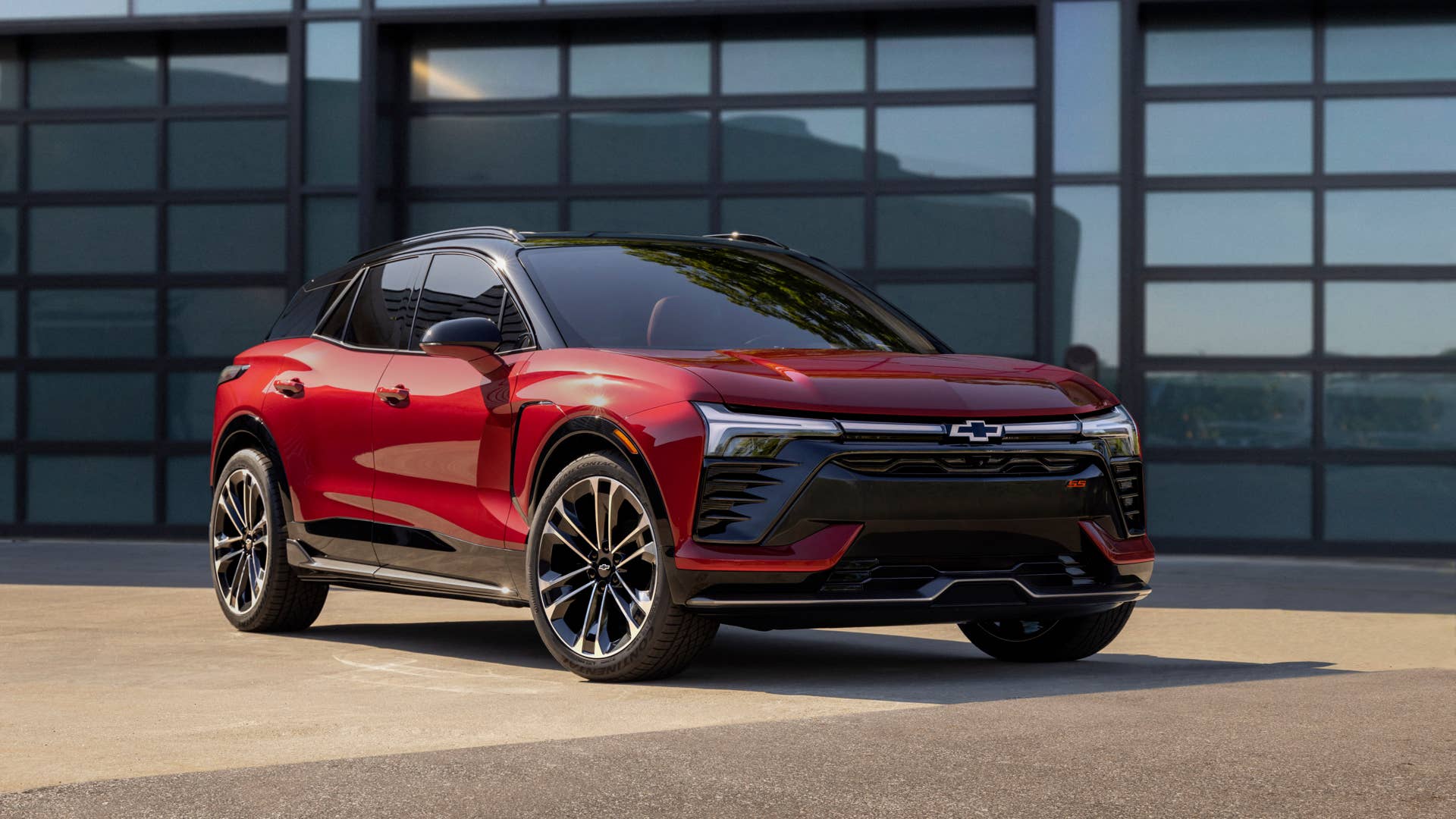 Three-quarter view of 2024 Chevrolet Blazer EV SS in Radiant Red Tintcoat. Preproduction model shown. Actual production model may vary. 2024 Chevrolet Blazer EV available Spring 2023.