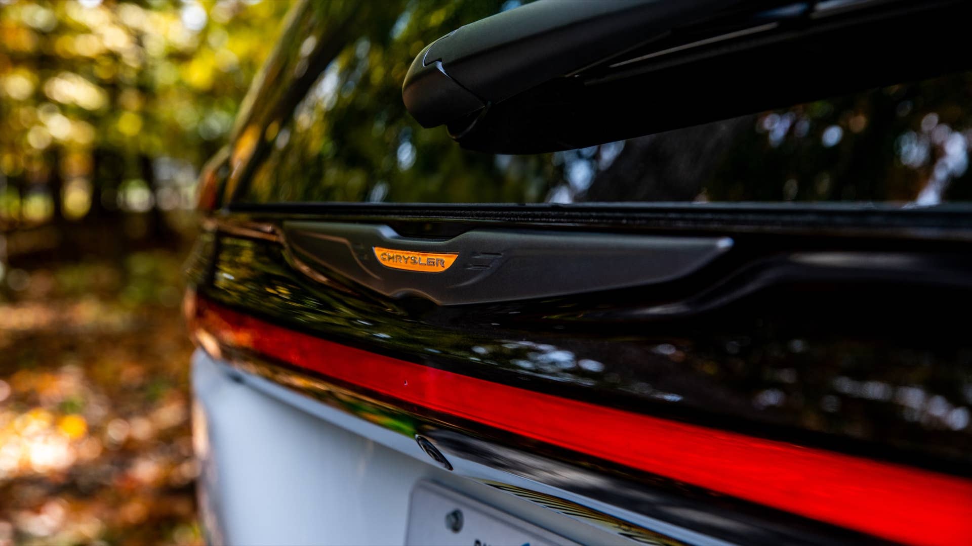 The 2023 Chrysler Pacifica Road Tripper features unique exterior Brilliant Orange badging, wheel accents and graphics.