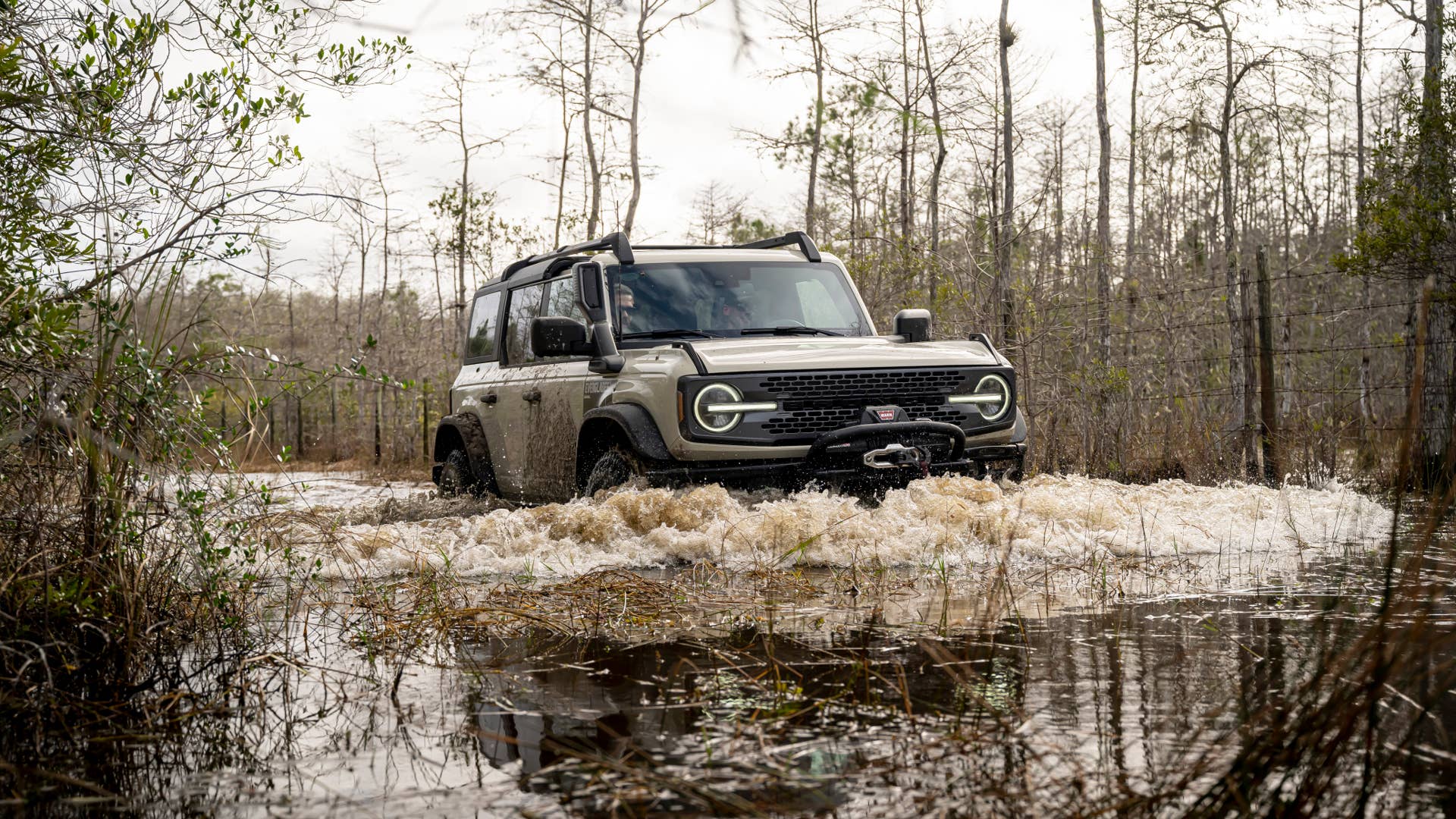 Preproduction model shown. Available summer 2022. Limited availability. Desert Sand paint is optional. Ford Accessories shown. Professional driver on a closed course. Always consult the Owner’s Manual before off-road driving, know your terrain and trail difficulty, and use appropriate safety gear. Always determine the water depth before attempting a crossing and proceed slowly. Refer to your owner’s manual for detailed information regarding driving through water. Ford is committed to the preservation of the environment and treading lightly.