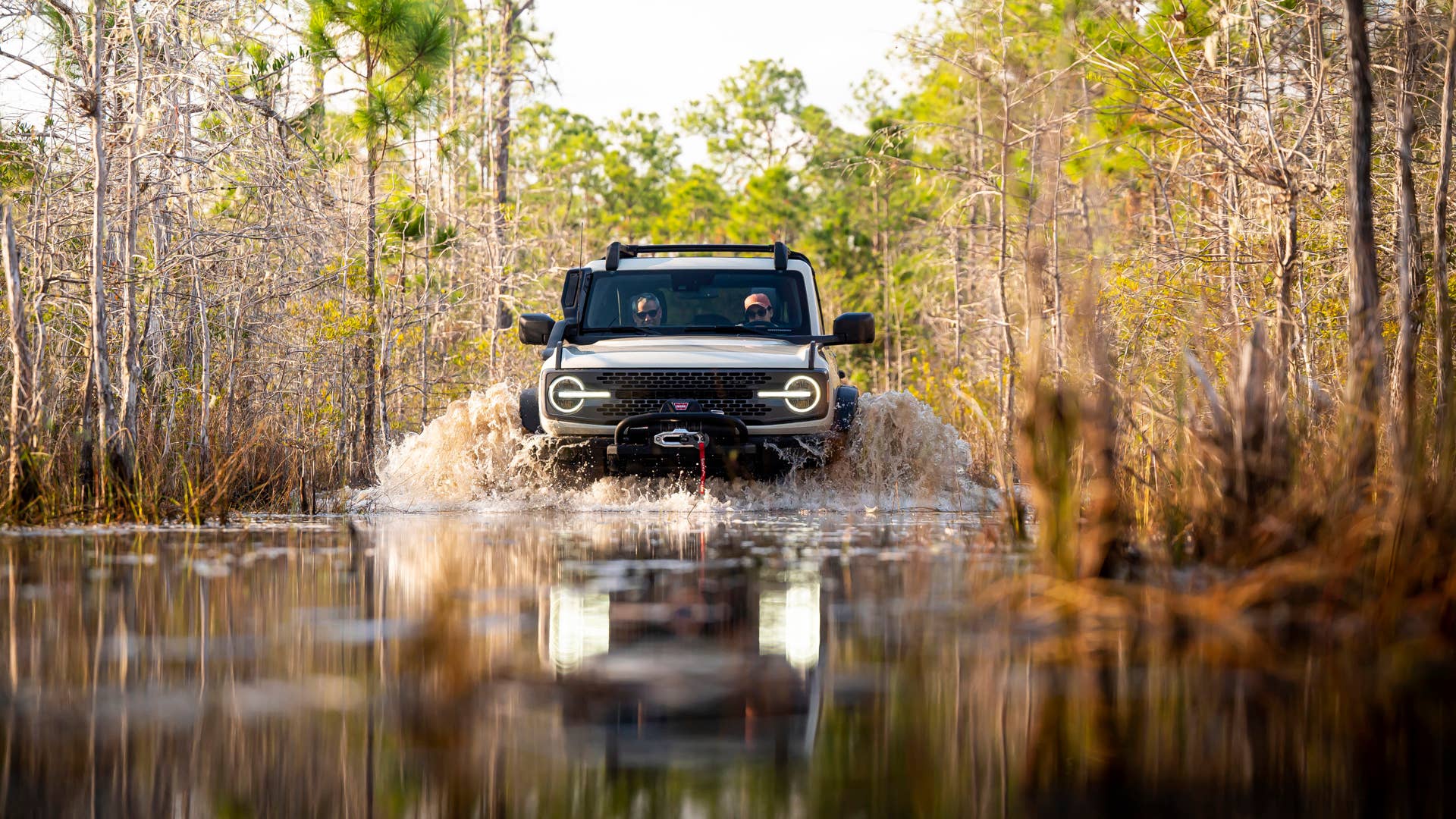 Preproduction model shown. Available summer 2022. Limited availability. Desert Sand paint is optional. Ford Accessories shown. Professional driver on a closed course. Always consult the Owner’s Manual before off-road driving, know your terrain and trail difficulty, and use appropriate safety gear. Always determine the water depth before attempting a crossing and proceed slowly. Refer to your owner’s manual for detailed information regarding driving through water. Ford is committed to the preservation of the environment and treading lightly.
