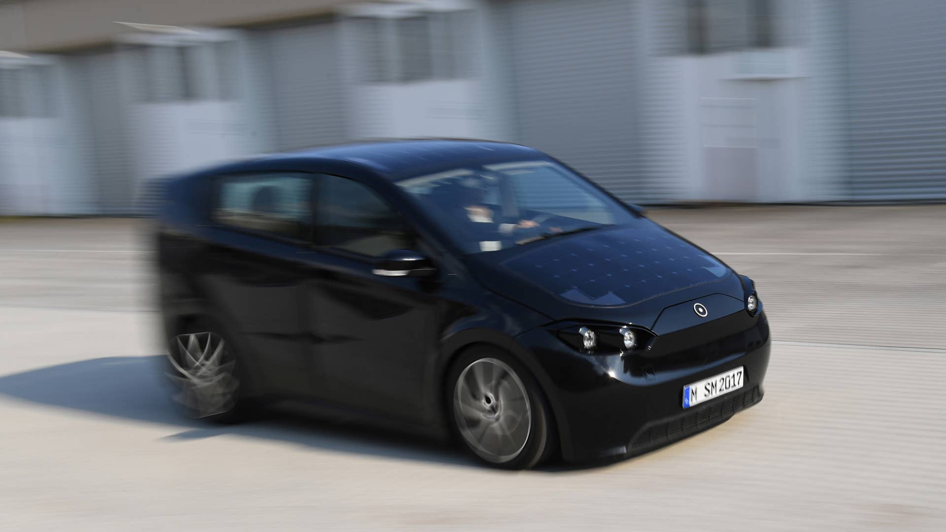 An employee of German solar car company Sono Motors drives the prototype car "Sion" across a compound near their office in Munich, Germany, August 1, 2018.  Picture taken August 1, 2018.   REUTERS/Andreas Gebert