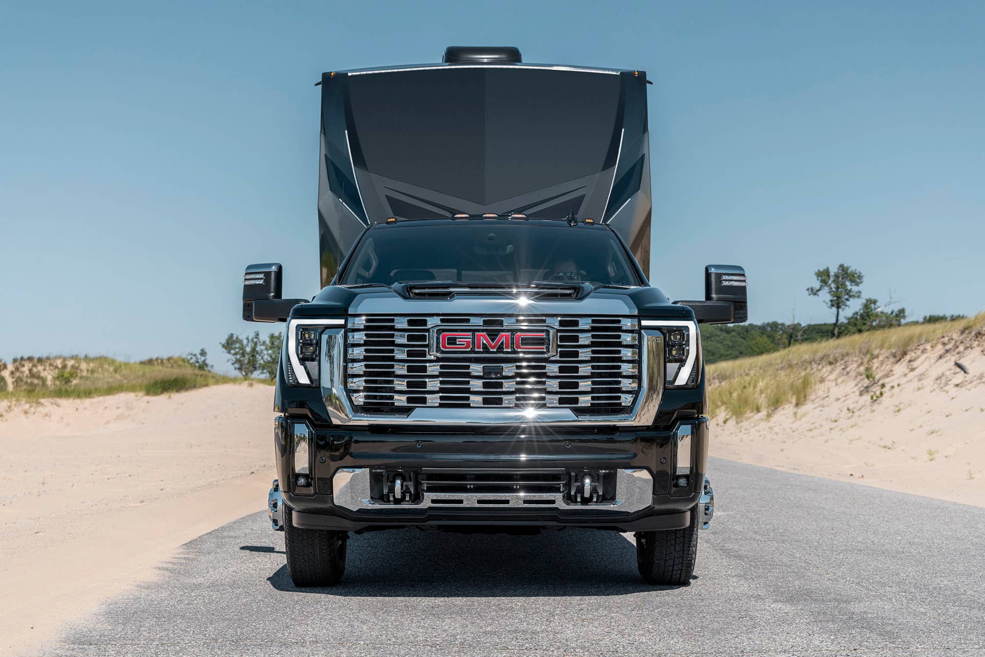 Front view of the GMC Sierra 3500 HD Denali towing a trailer