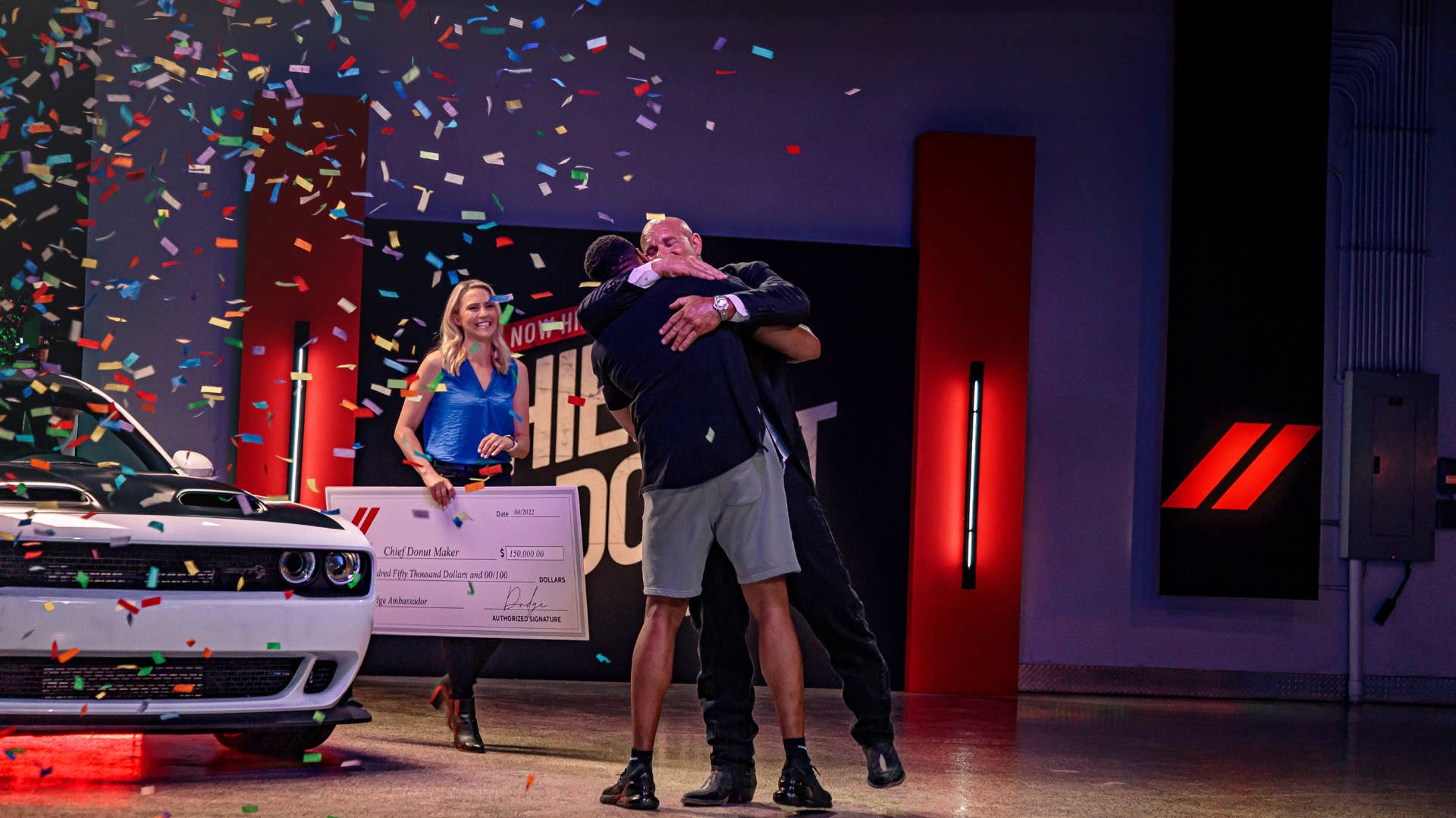 Bill Goldberg congratulates Preston Patterson, the winner of Dodge brand’s Chief Donut Maker competition.
