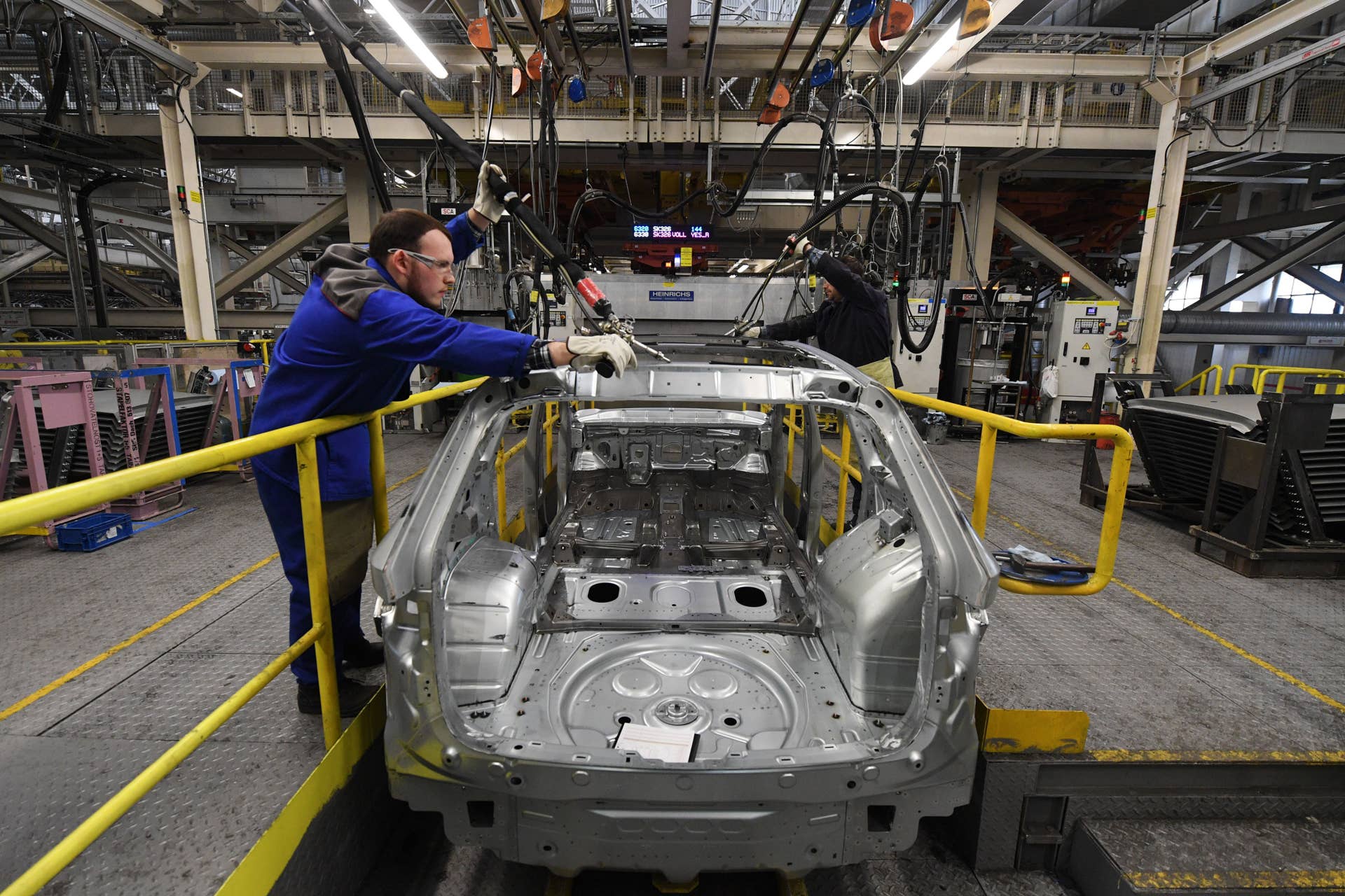 Workers assemble Skoda Kodiaq cars on the production line of carmaker GAZ plant in Nizhny Novgorod on April 16, 2019. (Photo by Kirill KUDRYAVTSEV / AFP) (Photo credit should read KIRILL KUDRYAVTSEV/AFP via Getty Images)
