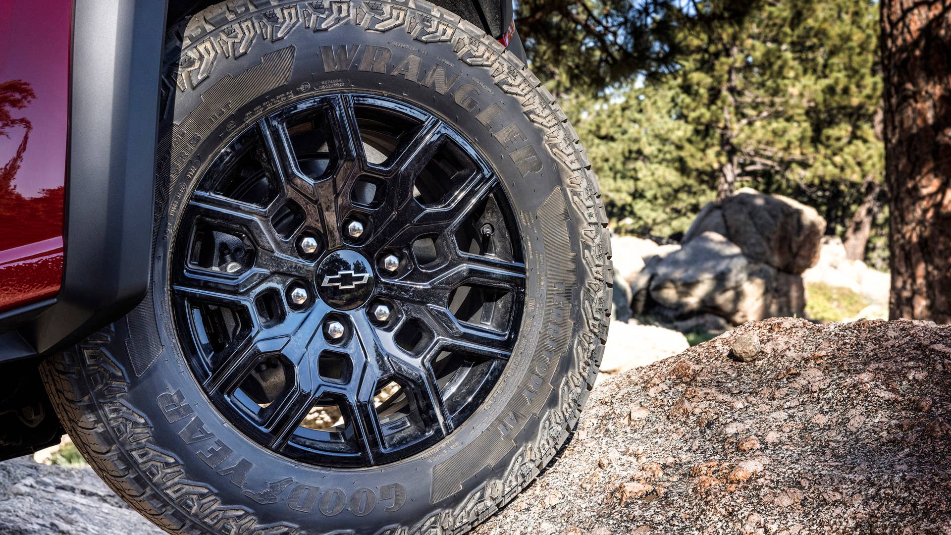Detail shot of Colorado Trail Boss wheel with Chevrolet bowtie and tire.