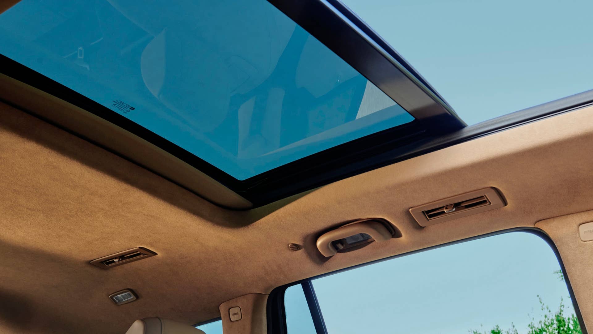 2023 Cadillac XT6 Sport Platinum interior shown in Maple Sugar highlighting Microfiber sueded headliner and UltraView Sunroof
