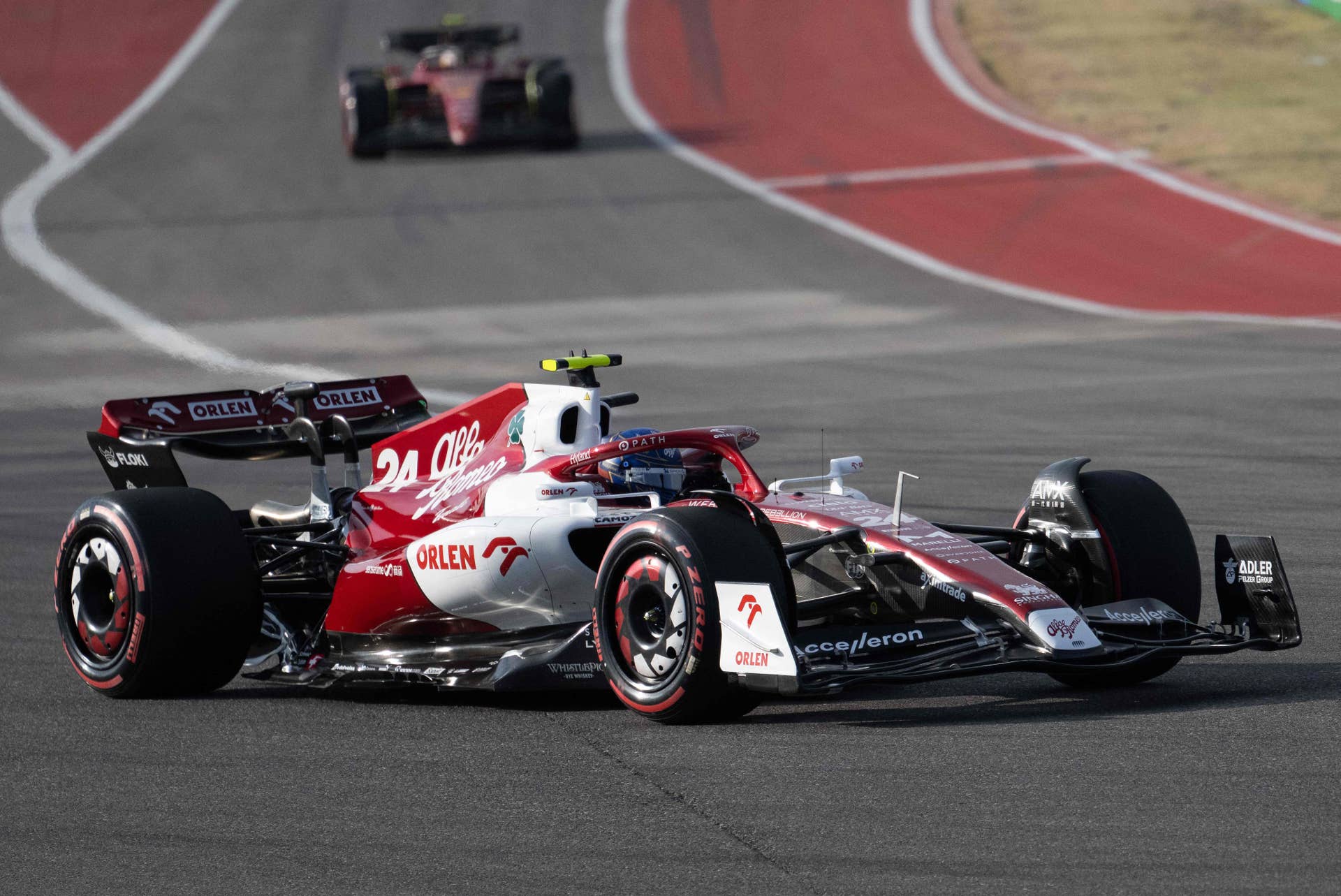 Alfa Romeo Chinese driver Zhou Guanyu (front) races during the qualifying session for the Formula One United States Grand Prix, at the Circuit of the Americas in Austin, Texas, on October 22, 2022. (Photo by Jim WATSON / AFP) (Photo by JIM WATSON/AFP via Getty Images)