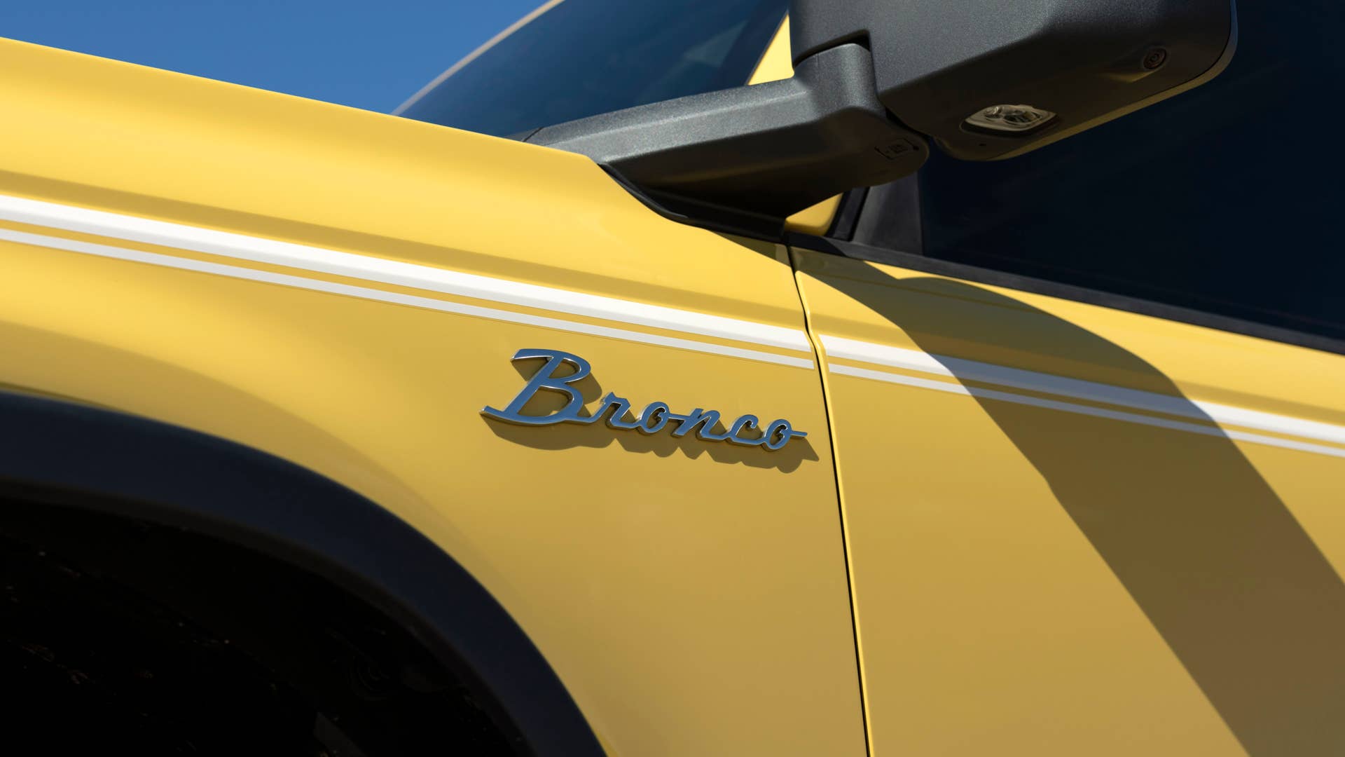 Bronco Heritage Limited Edition available winter 2023.  Limited availability. Preproduction models shown.  Always consult the Owner’s Manual before off-road driving, know your terrain and trail difficulty, and use appropriate safety gear.