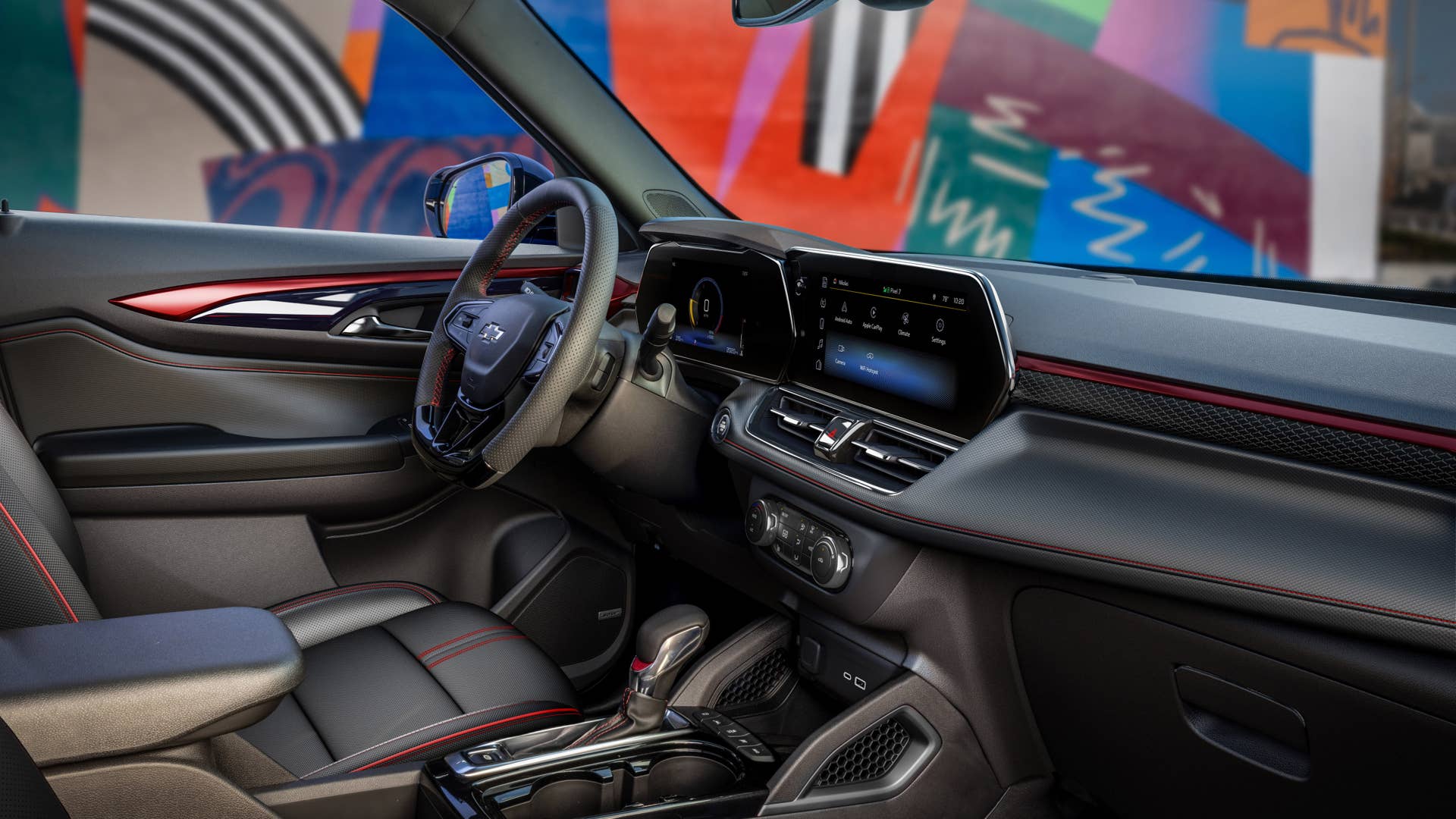 View of front cabin from passenger’s side of the 2024 Chevrolet Trailblazer RS with Jet Black with Red Accents interior. Preproduction model shown. Actual production model may vary. Available in fall 2023.