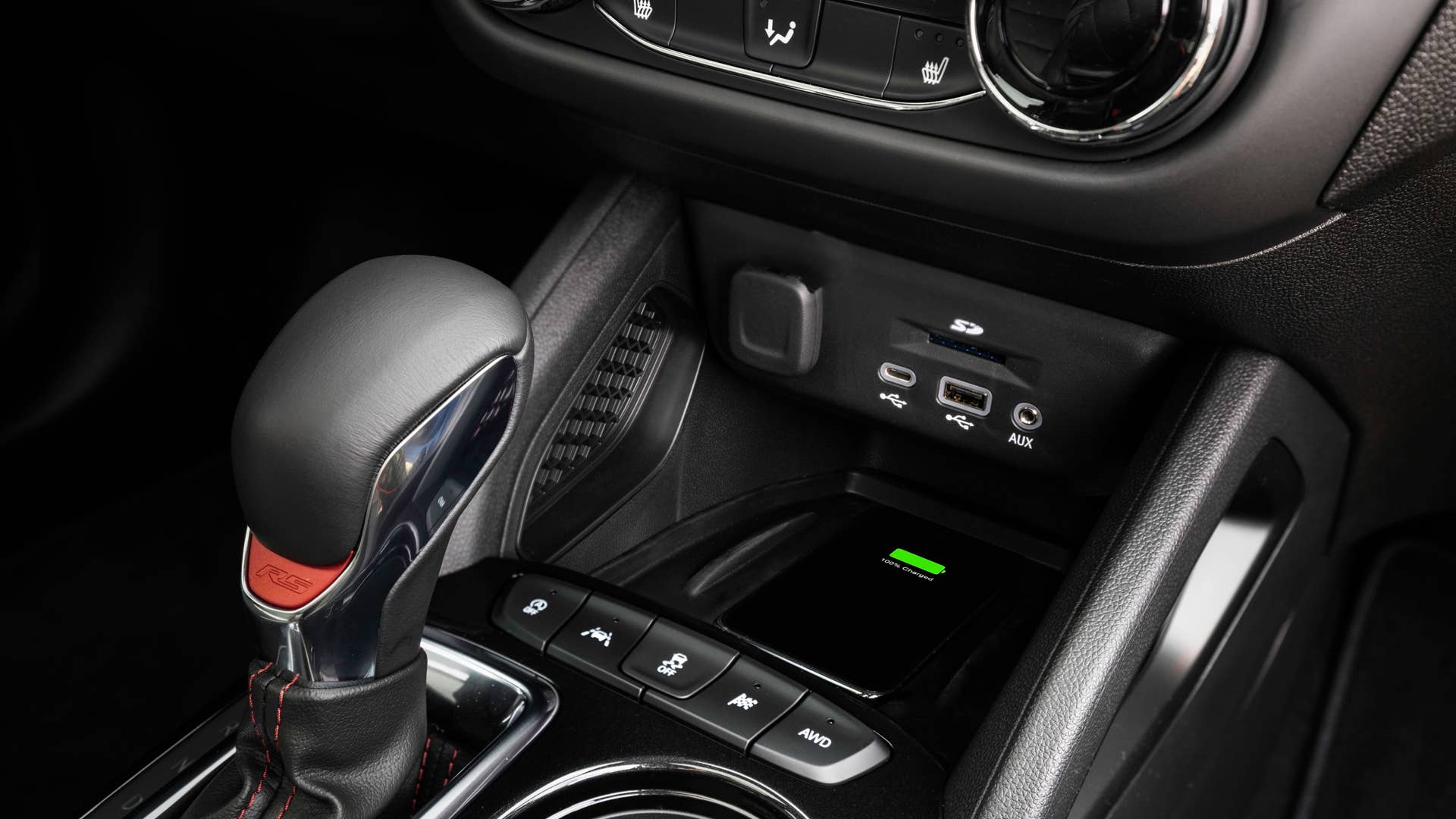 Close up view of front console in in 2024 Chevrolet Trailblazer RS with Jet Black with Red Accents interior. Preproduction model shown. Actual production model may vary. Available in fall 2023.