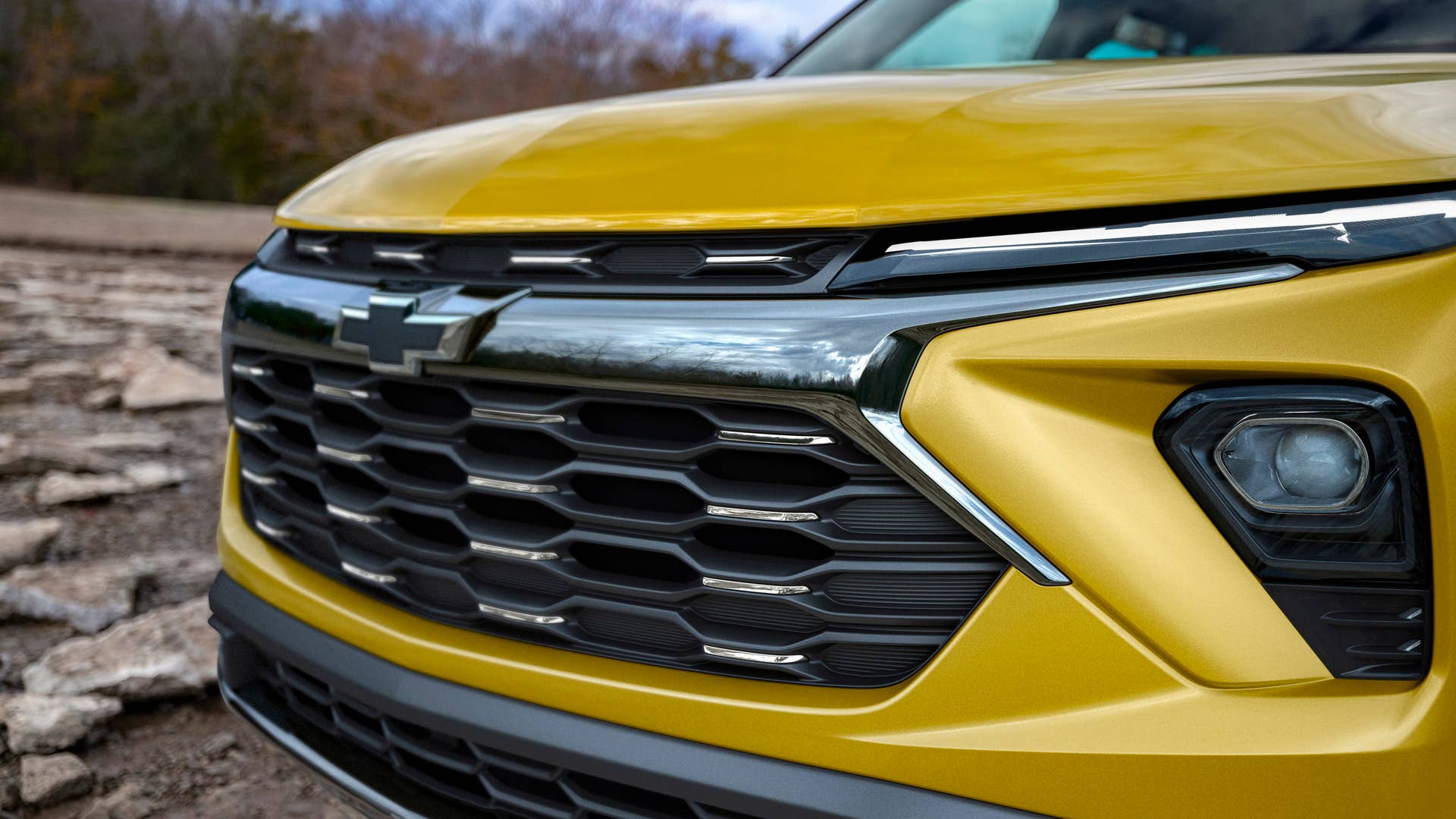 Close up view of grille and driver side headlight on 2024 Chevrolet Trailblazer ACTIV in Copper Harbor Metallic. Preproduction model shown. Actual production model may vary. Available in fall 2023.