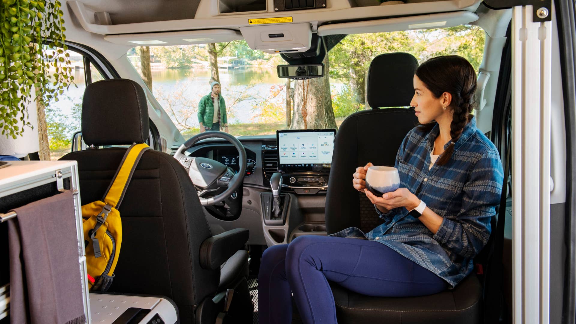 The 2023 Transit Trail comes standard with front swivel seats to easily expand the living space in the cargo area. (2023 Ford Transit Trail available Fall 2022. Preproduction model shown with aftermarket equipment.)