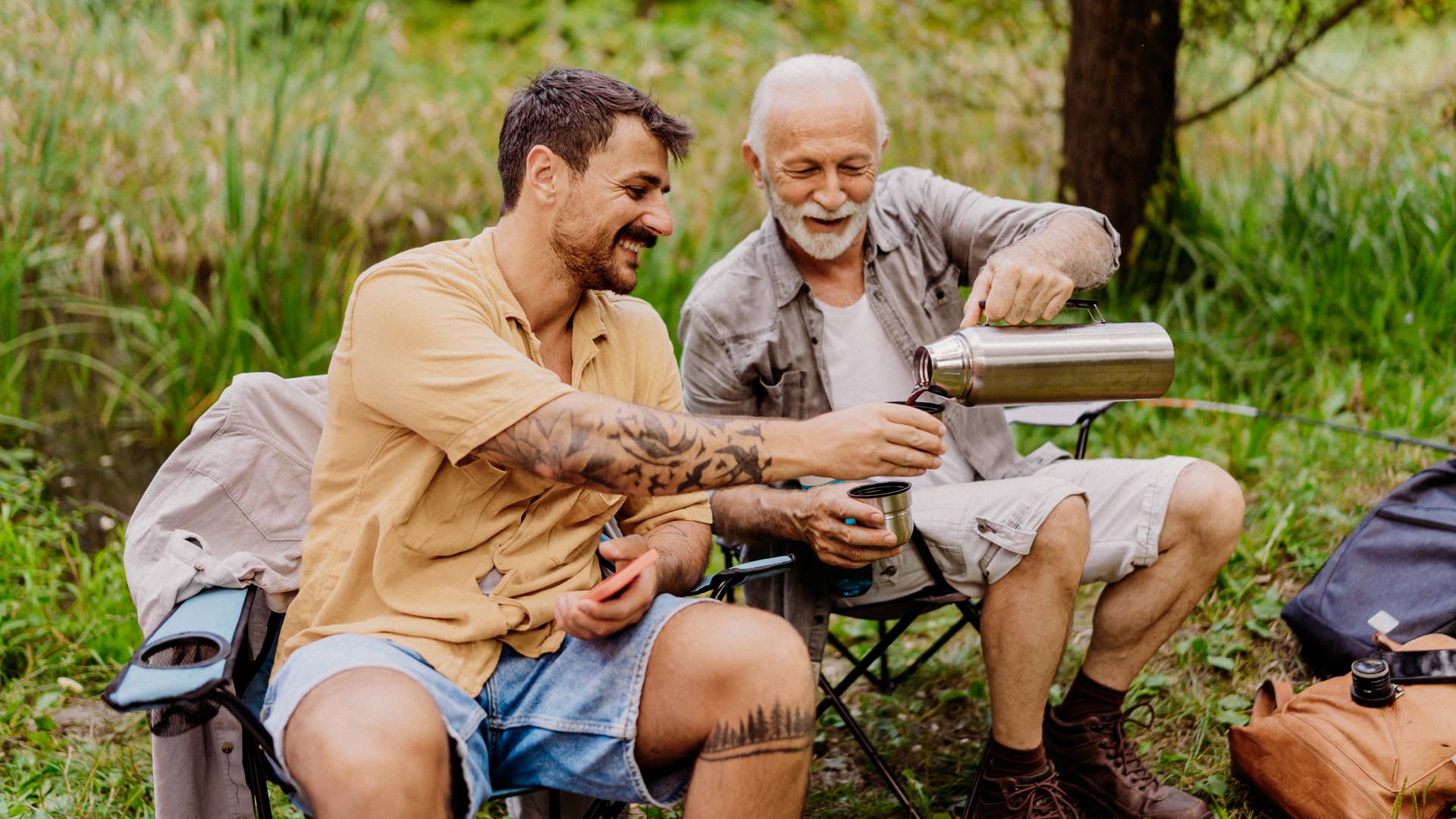 Father and son camping and fishing together