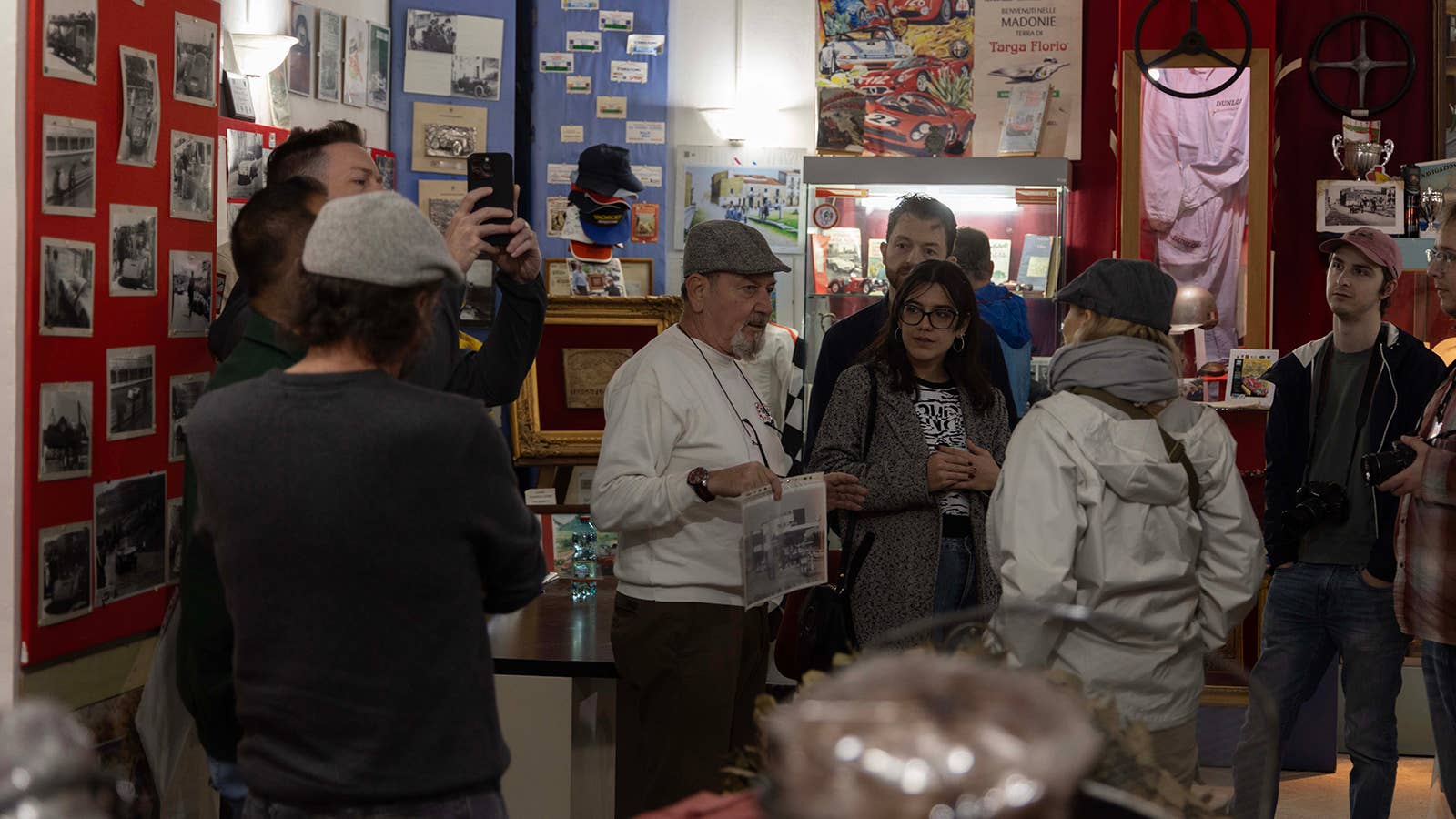 The museum owner speaking with guests