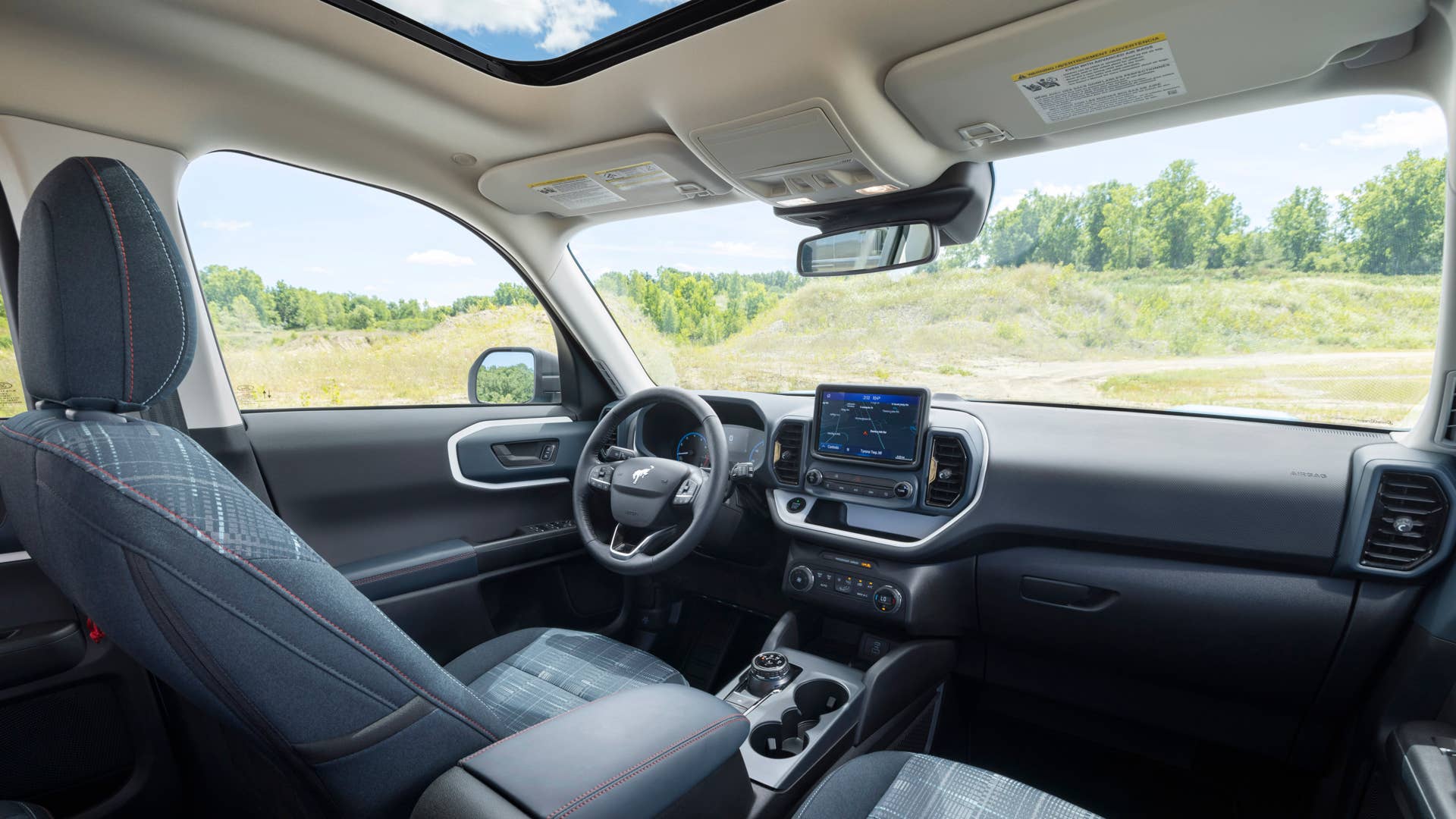Bronco Heritage Edition available winter 2023. Limited availability. Preproduction models shown.  Always consult the Owner’s Manual before off-road driving, know your terrain and trail difficulty, and use appropriate safety gear.