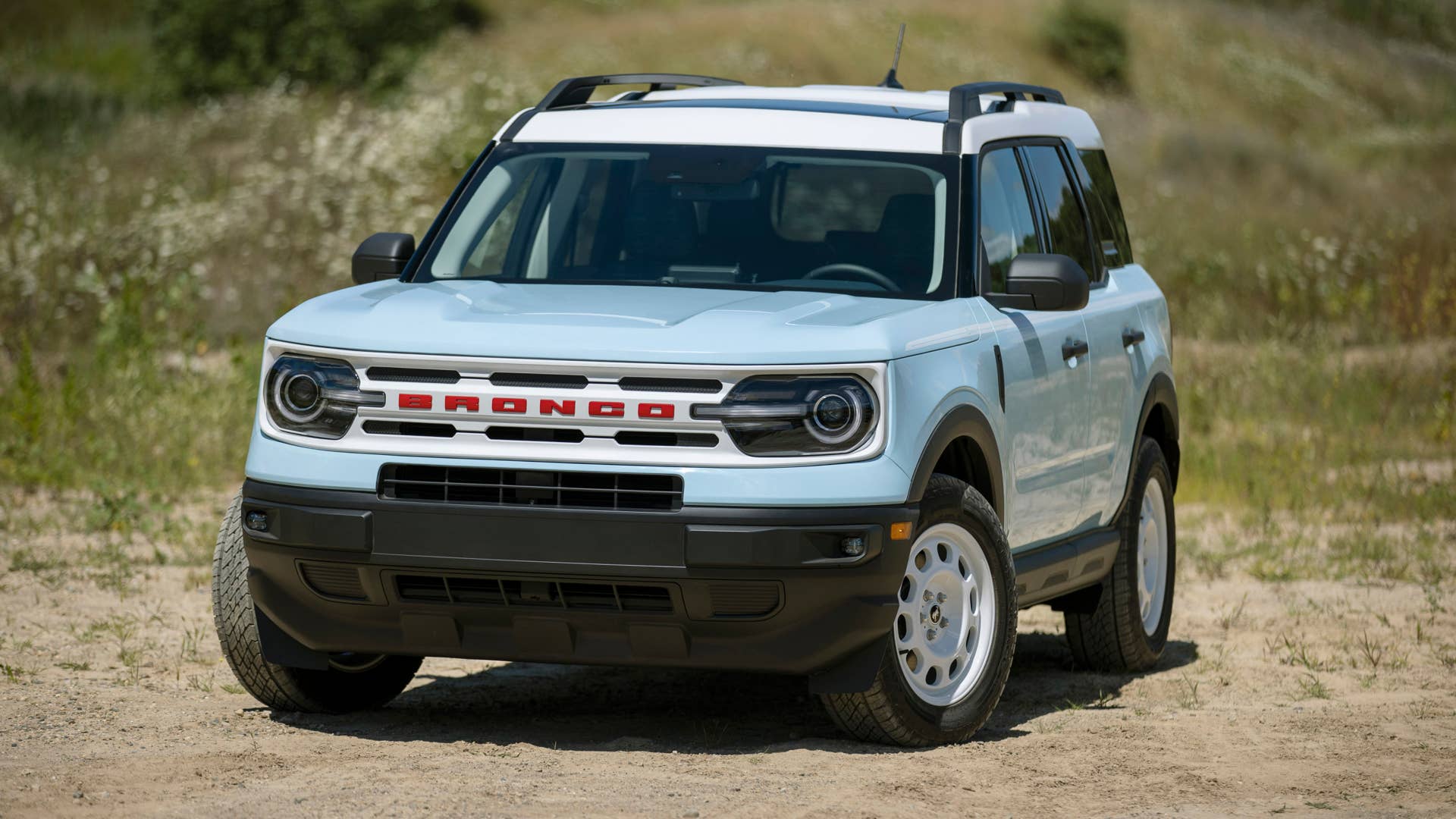 Bronco Heritage Edition available winter 2023. Limited availability. Preproduction models shown.  Always consult the Owner’s Manual before off-road driving, know your terrain and trail difficulty, and use appropriate safety gear.
