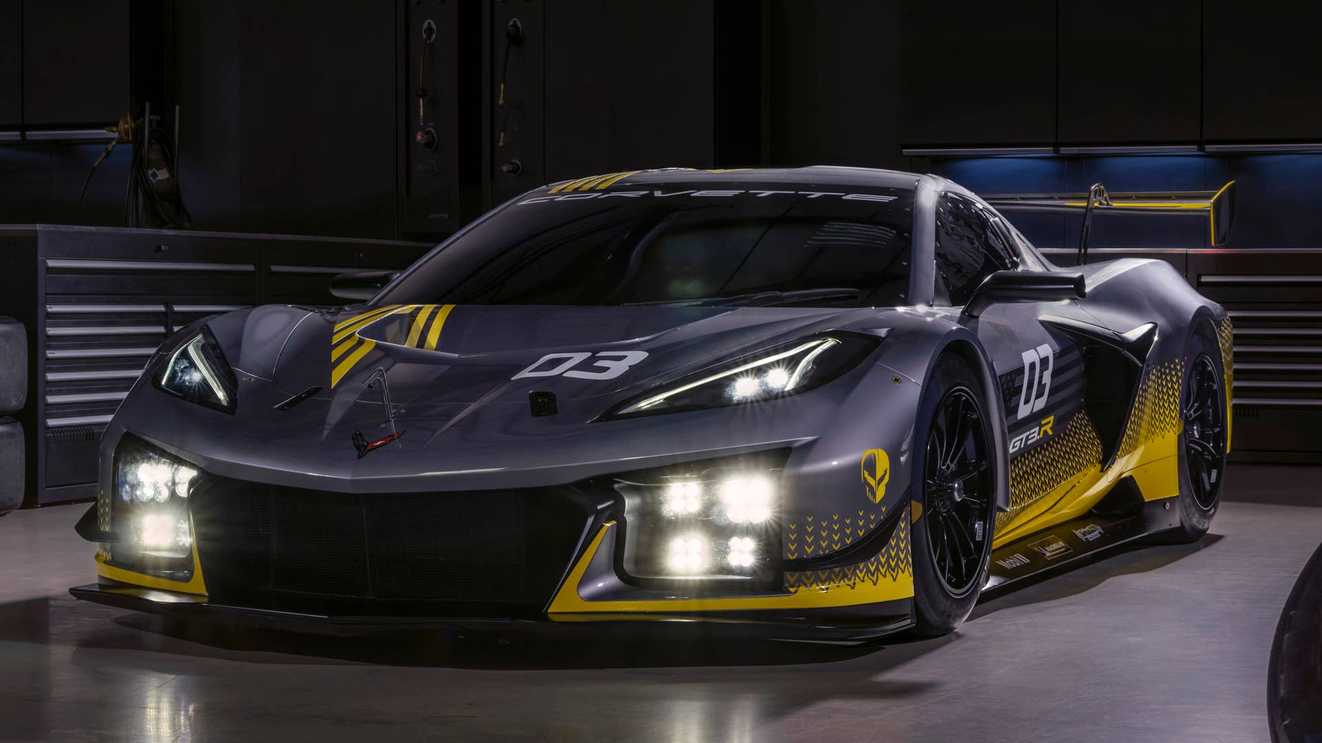 Front 7/8 view of 2024 Chevrolet Corvette Z06 GT3.R parked in a race car garage. Pre-production model shown. Actual production model may vary. Model year 2024 Corvette Z06 GT3.R will be available later this year.
