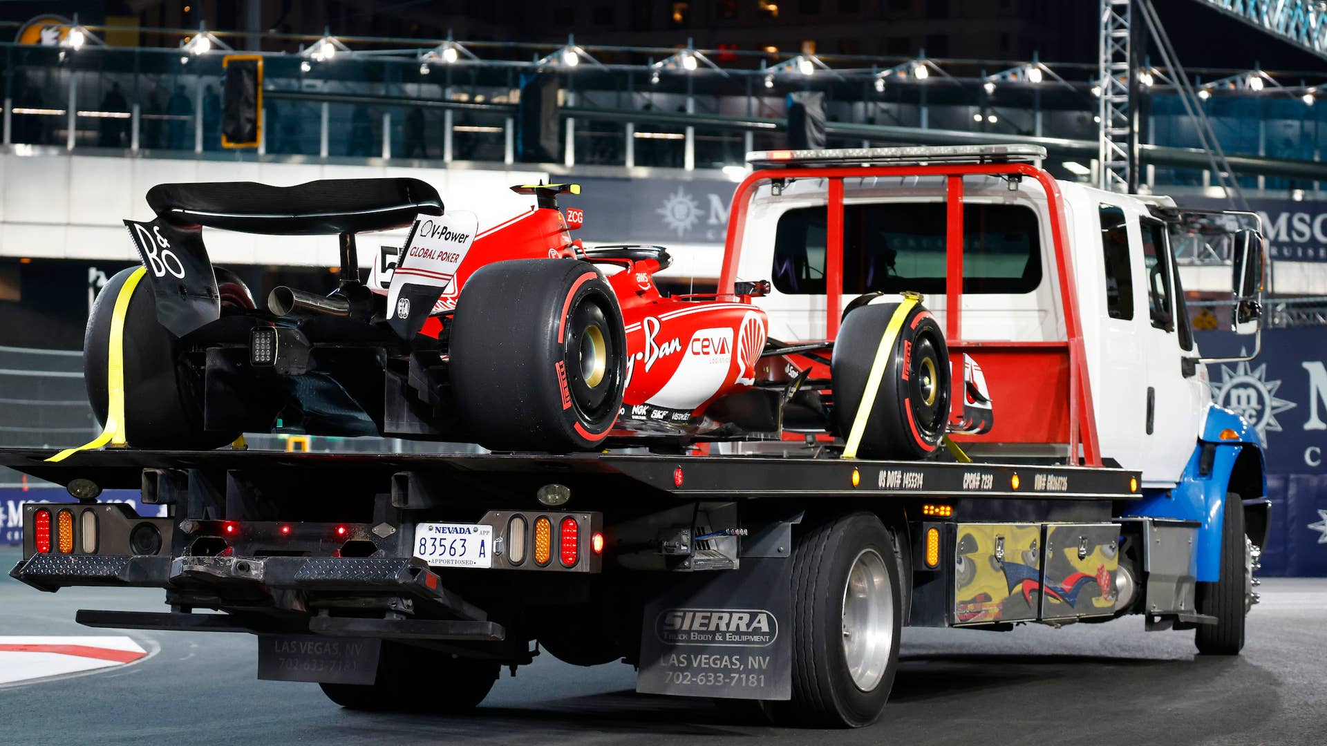LAS VEGAS, NEVADA - NOVEMBER 16: The car of Carlos Sainz of Spain and Ferrari is removed from the circuit on a truck after stopping on track during practice ahead of the F1 Grand Prix of Las Vegas at Las Vegas Strip Circuit on November 16, 2023 in Las Vegas, Nevada. (Photo by Chris Graythen/Getty Images)