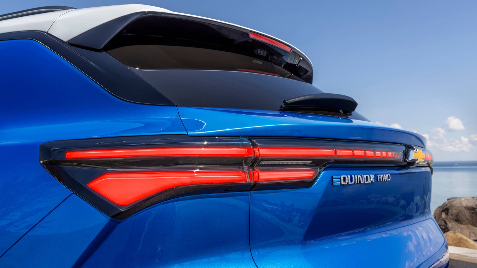 Close up view of driver’s side taillamp on 2024 Chevrolet Equinox EV 3LT in Riptide Blue. Preproduction model shown. Actual production model may vary. 2024 Chevrolet Equinox EV available Fall 2023.