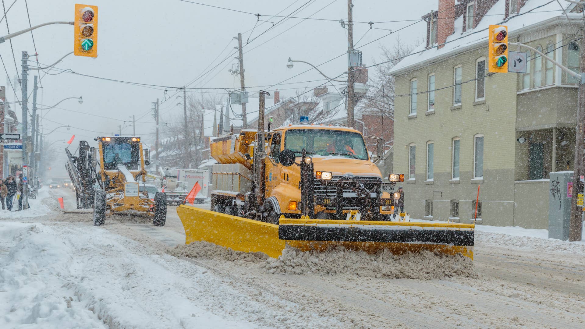 Toronto - December 11, 2014 - Snowplows clearing a main street in downtown Toronto