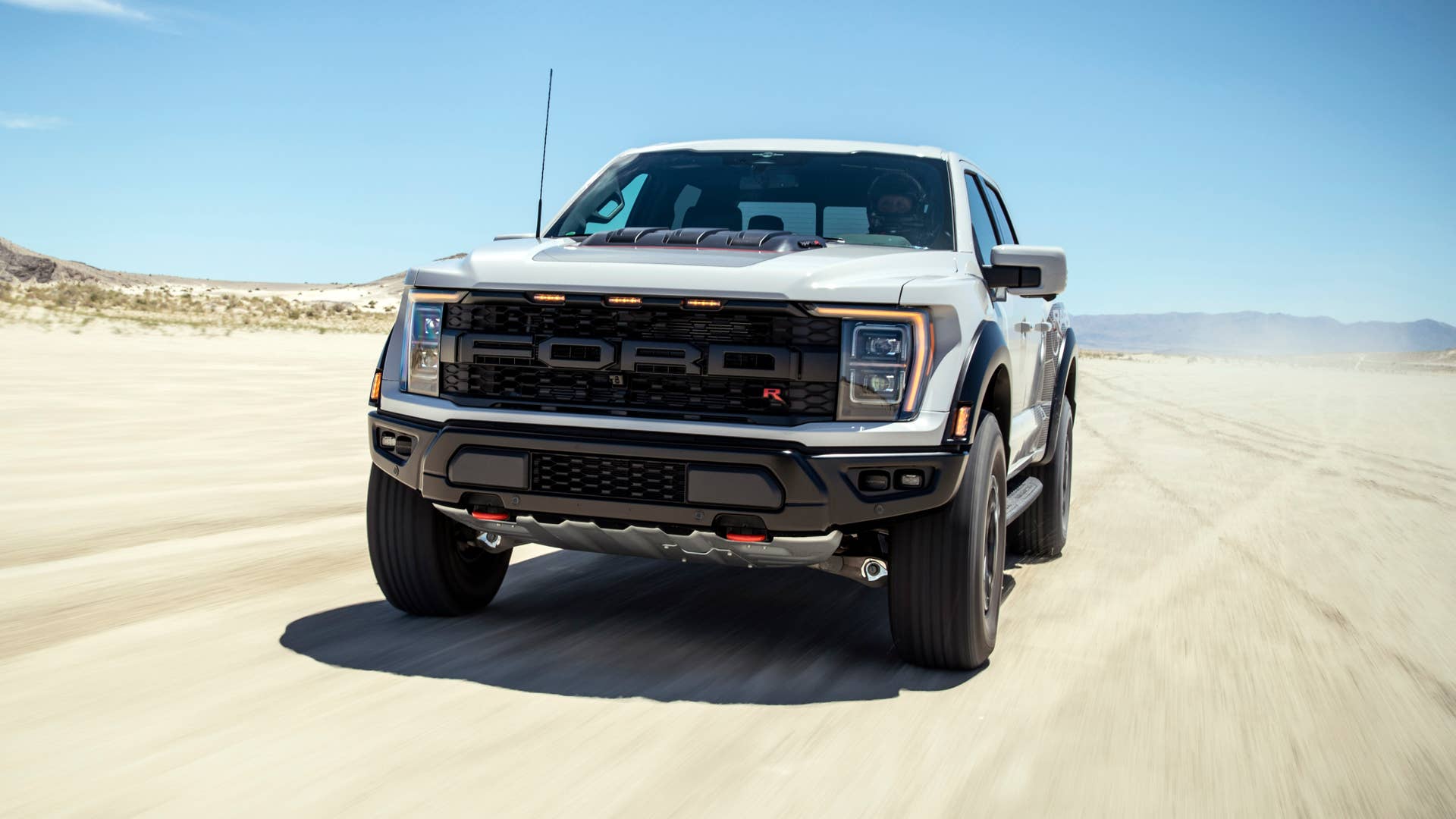 Preproduction model with optional equipment shown. Available late 2022. Professional driver on a closed course. Always consult the Raptor supplement to the Owner’s Manual before off-road driving, know your terrain and trail difficulty, and use appropriate safety gear.