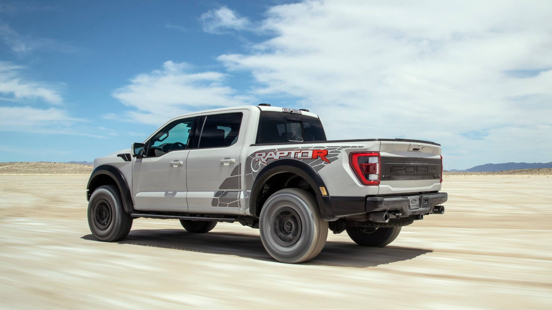 Preproduction model with optional equipment shown. Available late 2022. Professional driver on a closed course. Always consult the Raptor supplement to the Owner’s Manual before off-road driving, know your terrain and trail difficulty, and use appropriate safety gear.
