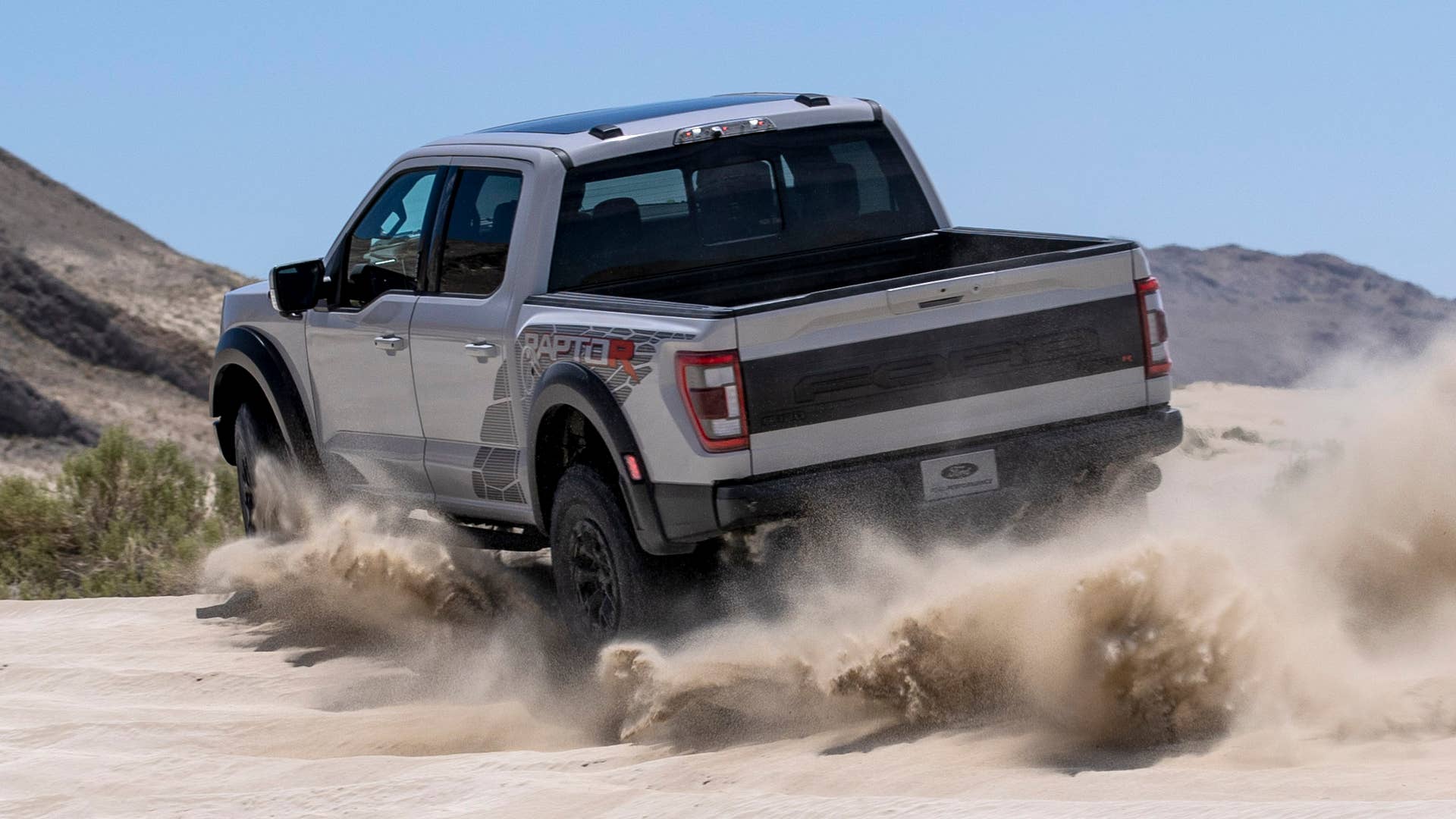 Preproduction model with optional equipment shown. Available late 2022. Professional driver on a closed course. Always consult the Raptor supplement to the Owner’s Manual before off-road driving, know your terrain and trail difficulty, and use appropriate safety gear.