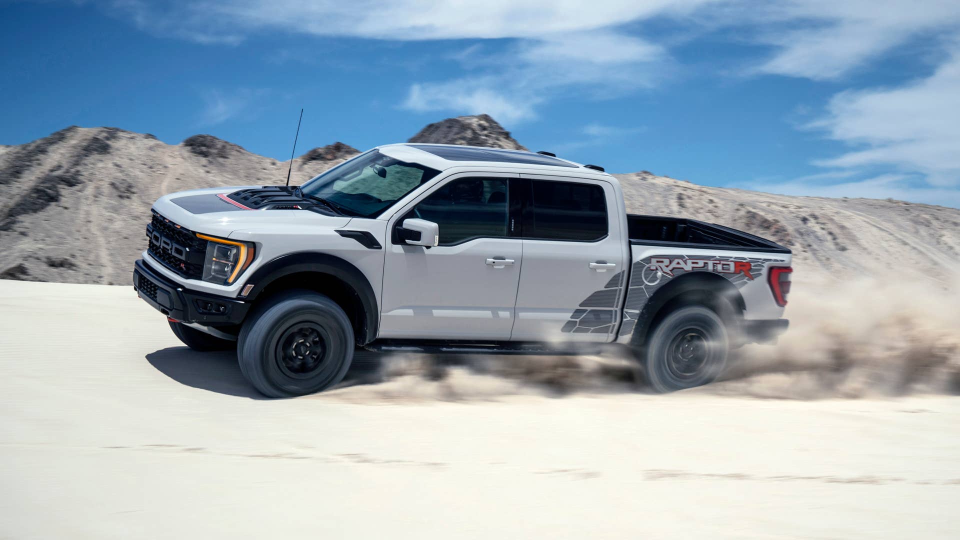 Preproduction model with optional equipment shown. Available late 2022. Professional driver on a closed course. Always consult the Raptor supplement to the Owner’s Manual before off-road driving, know your terrain and trail difficulty, and use appropriate safety gear.