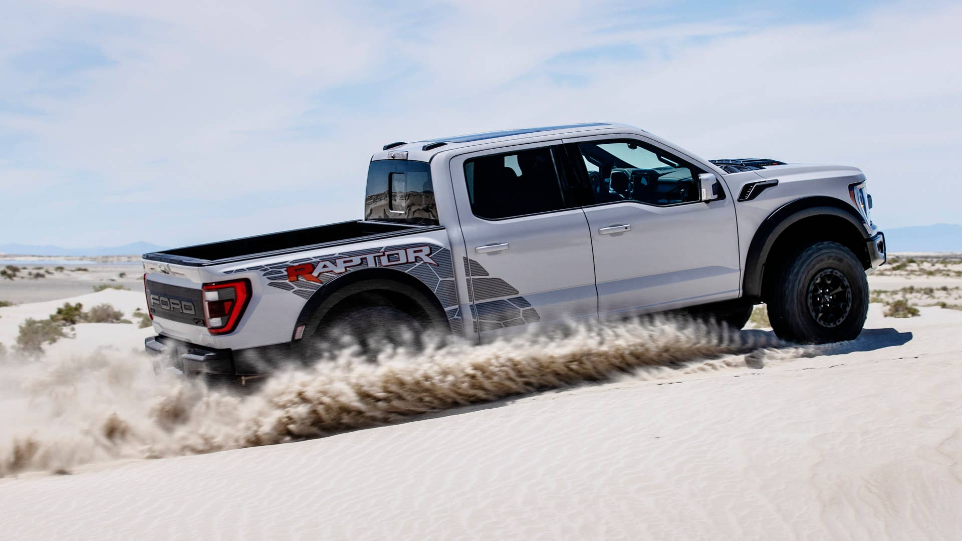 Preproduction model with optional equipment shown. Available late 2022. Professional driver on a closed course. Always consult the Raptor supplement to the Owner’s Manual before off-road driving, know your terrain and trail difficulty, and use appropriate safety gear.