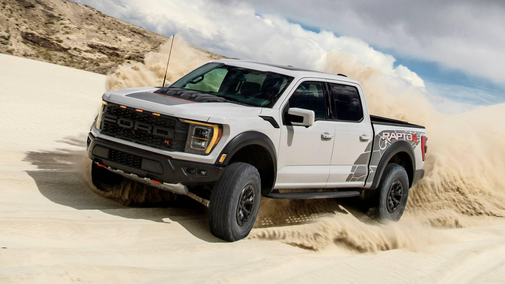 Preproduction model with optional equipment shown. Available late 2022. Professional driver on a closed course. Always consult the Raptor supplement to the Owner’s Manual before off-road driving, know your terrain and trail difficulty, and use appropriate safety gear.