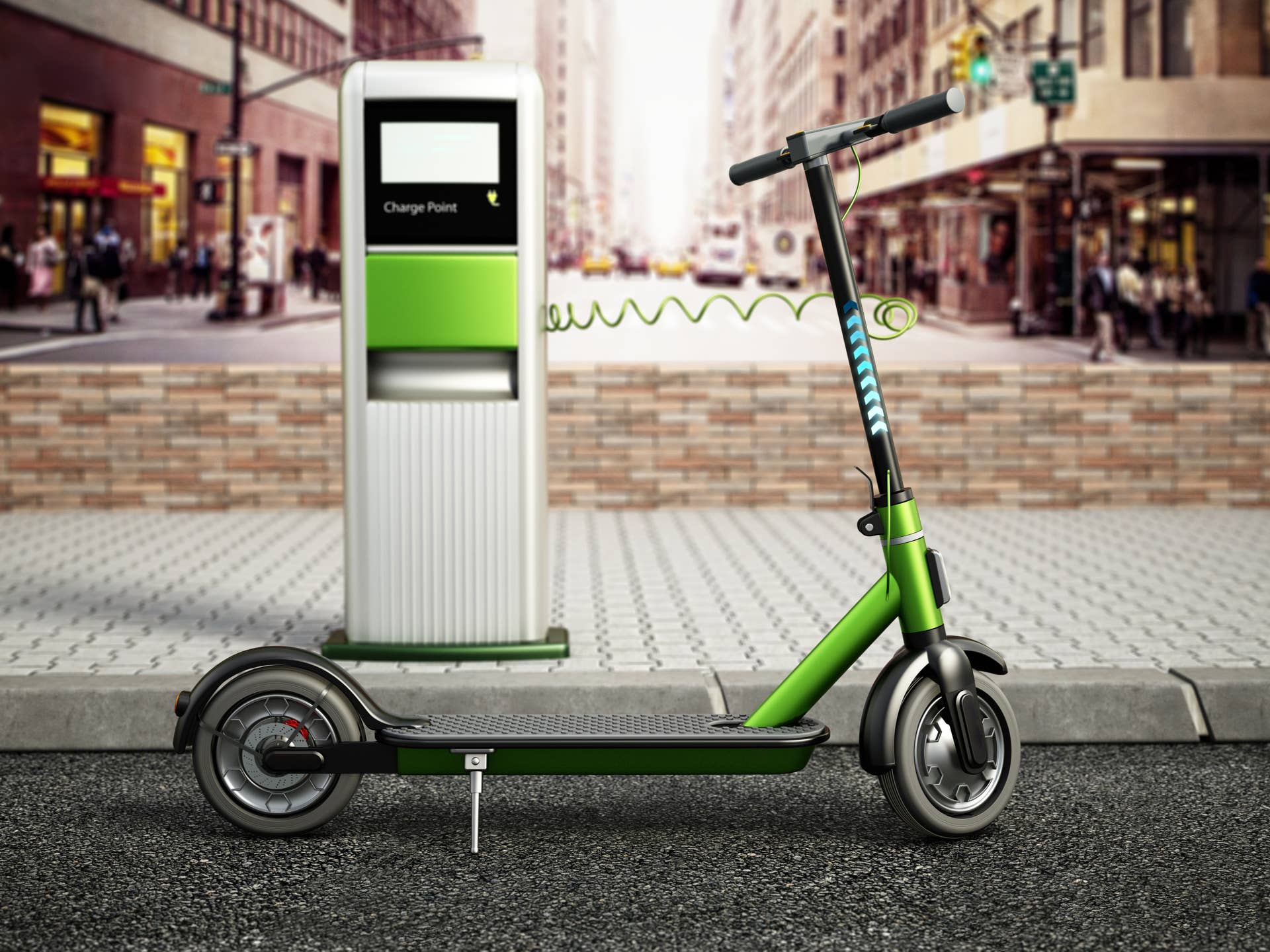 Electric scooter and charge point in the street.