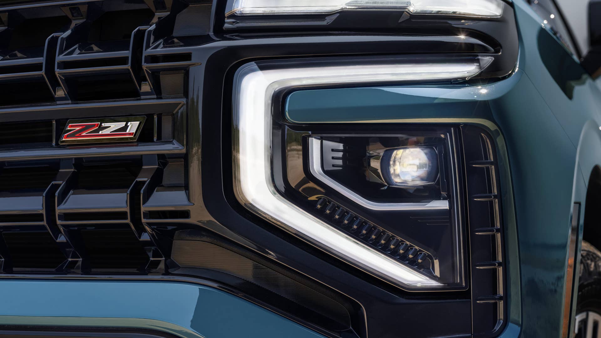 Detailed shot of new headlight and  Z71 badge in grille of the 2025 Tahoe