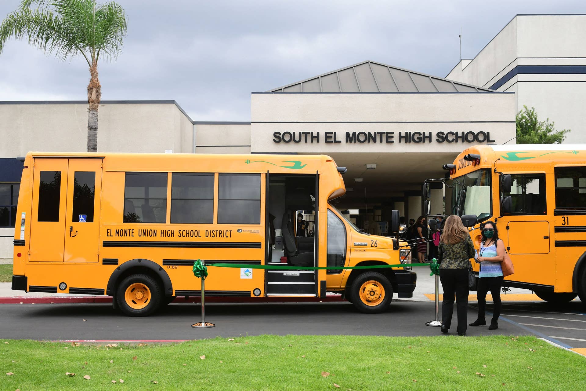 All-new EV schoolbuses are seen at South El Monte High School ahead of a ceremony introducing a fleet of 11 all-electric buses on August 18, 2021 in El Monte, California. - A ceremony was held to introduce the fleet of 11 buses which are part of the California Air Resources Board's (CARB) $9.8 million Clean Mobility in Schools grant to the school district to help achieve California's ecological conservation goals and promote clean transportation among students, educators and their families. (Photo by Frederic J. BROWN / AFP) (Photo by FREDERIC J. BROWN/AFP via Getty Images)