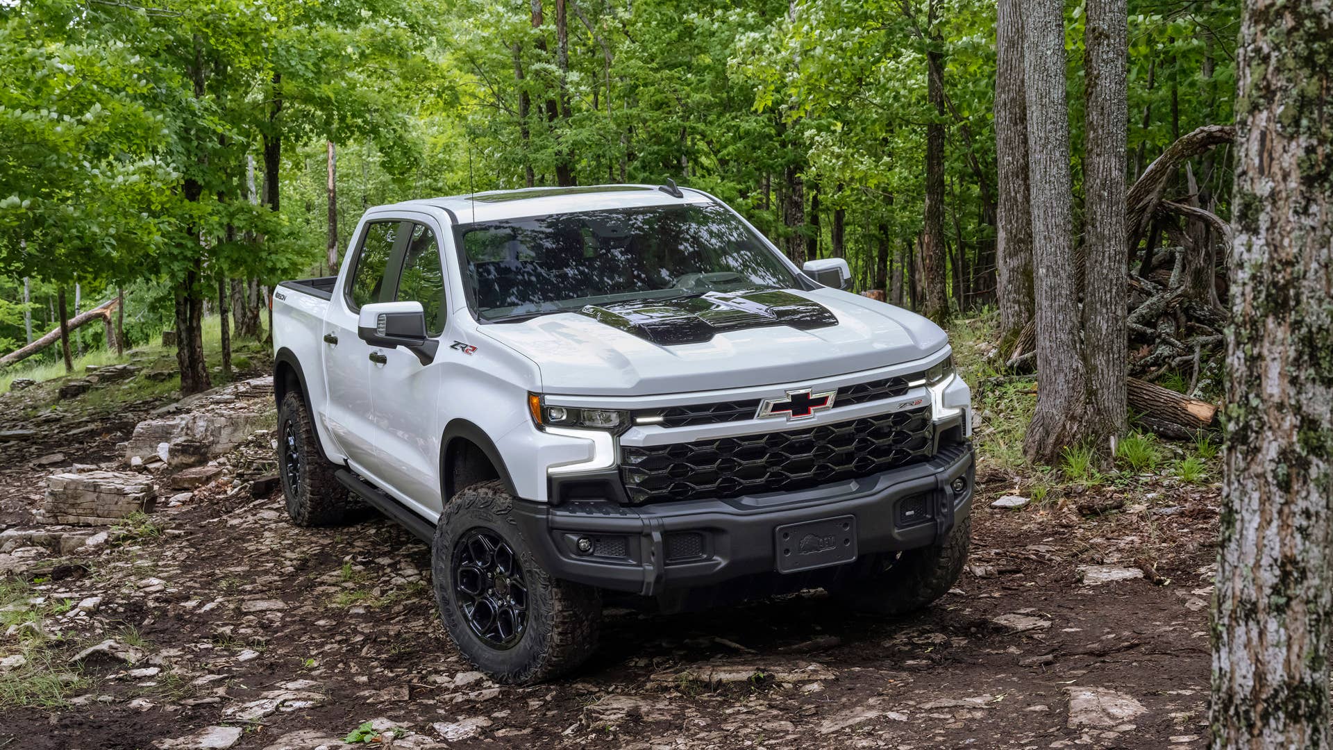 The 2024 Chevrolet Silverado ZR2 Bison on a wooded off-road trail