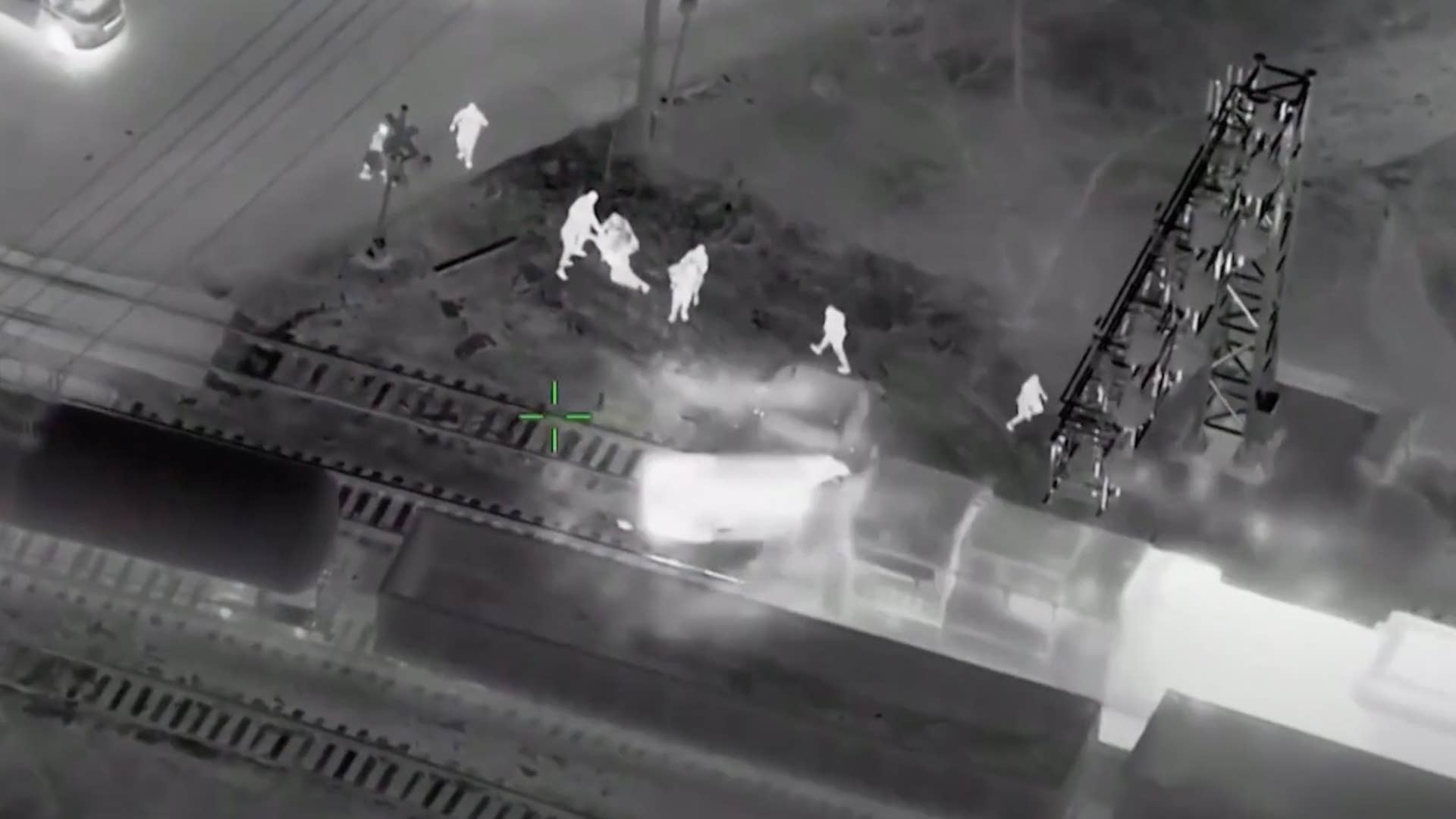 Watch police extract joyrider from stolen cop car seconds before train ...