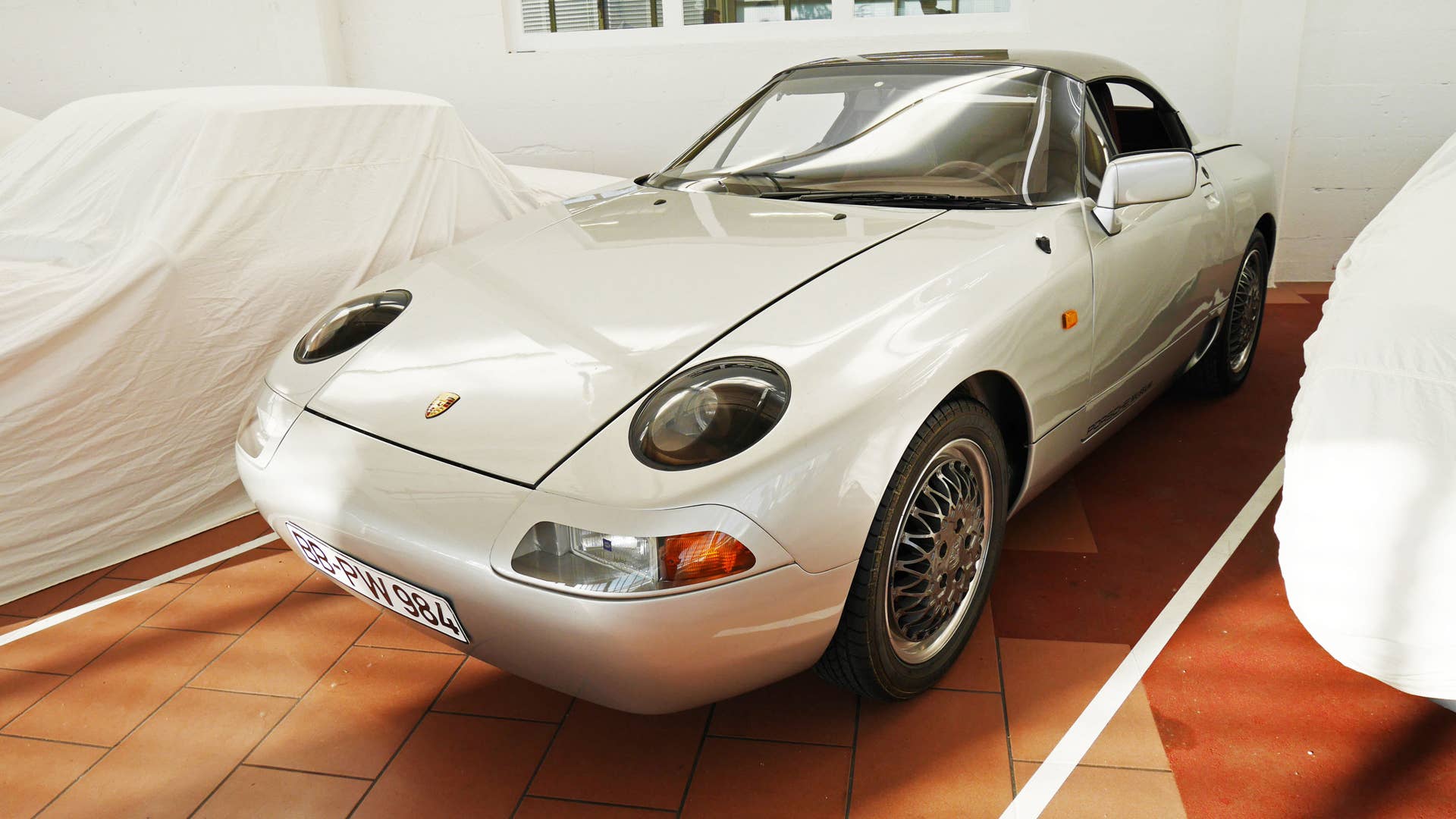 12 years before the Boxster entered production, Porsche introduced this 984 concept: a four-cylinder roadster with a retractable roof similar to a Ferrari Superamerica's.