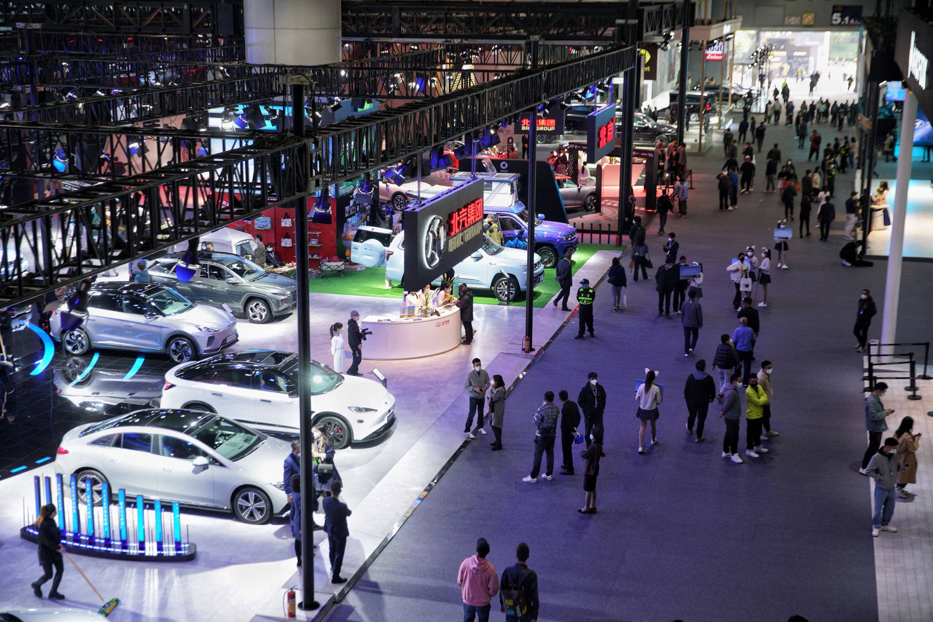 People visit the 20th Guangzhou International Automobile Exhibition on its opening day at Guangzhou, in China's southern Guangdong province on December 30, 2022. - China OUT (Photo by AFP) / China OUT (Photo by STR/AFP via Getty Images)