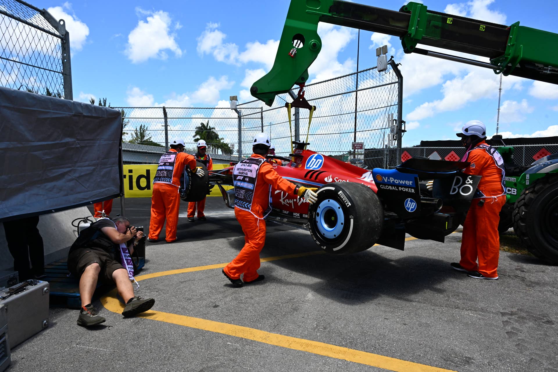 Track workers remove the car of Ferrari's Monegasque driver Charles Leclerc after he spun out during the practice session for the 2024 Miami Formula One Grand Prix at Miami International Autodrome in Miami Gardens, Florida, on May 3, 2024. (Photo by Giorgio Viera / AFP) (Photo by GIORGIO VIERA/AFP via Getty Images)