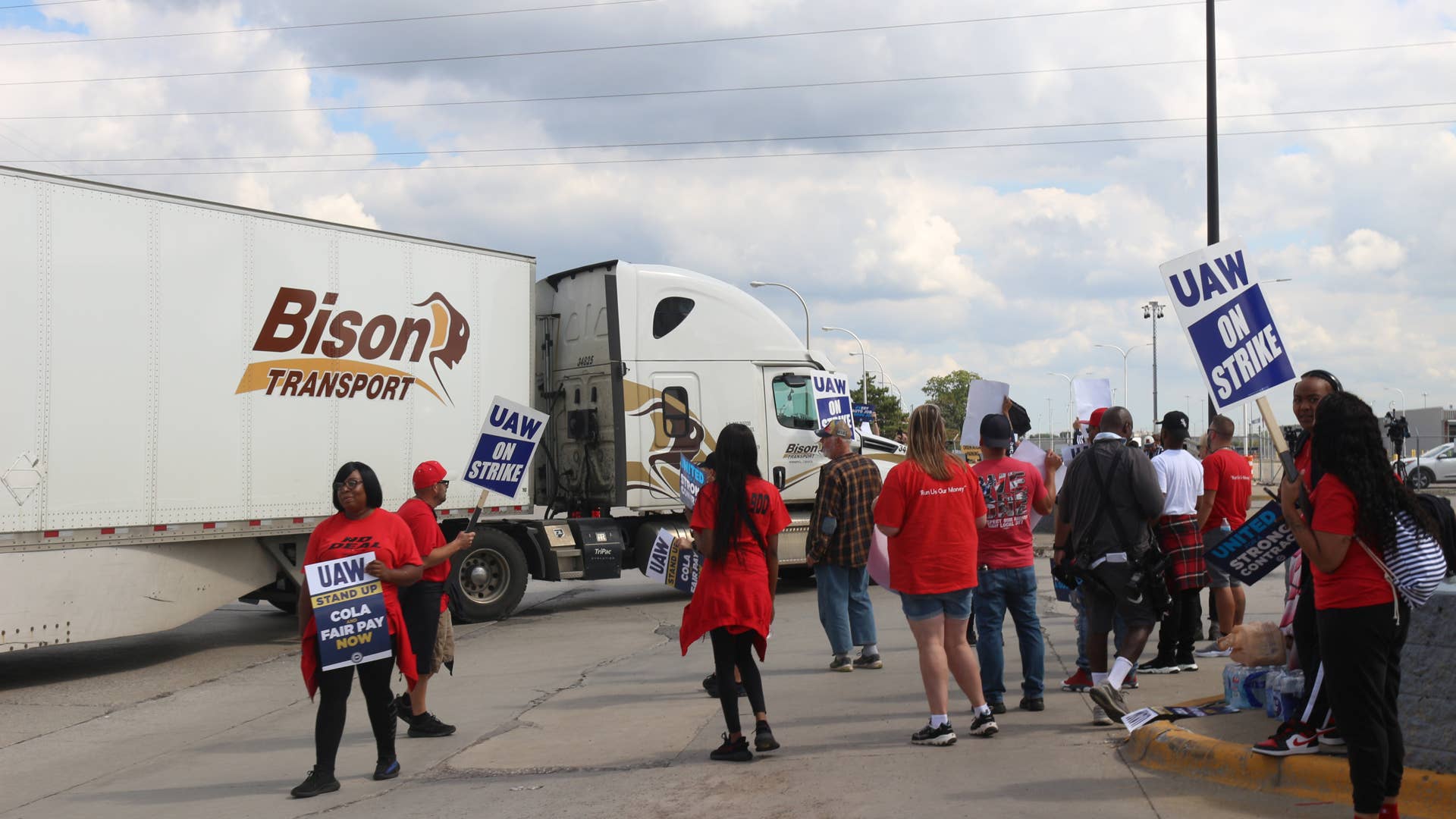 UAW Picketers block a truck attempting to enter the Michigan Assembly facility Friday.